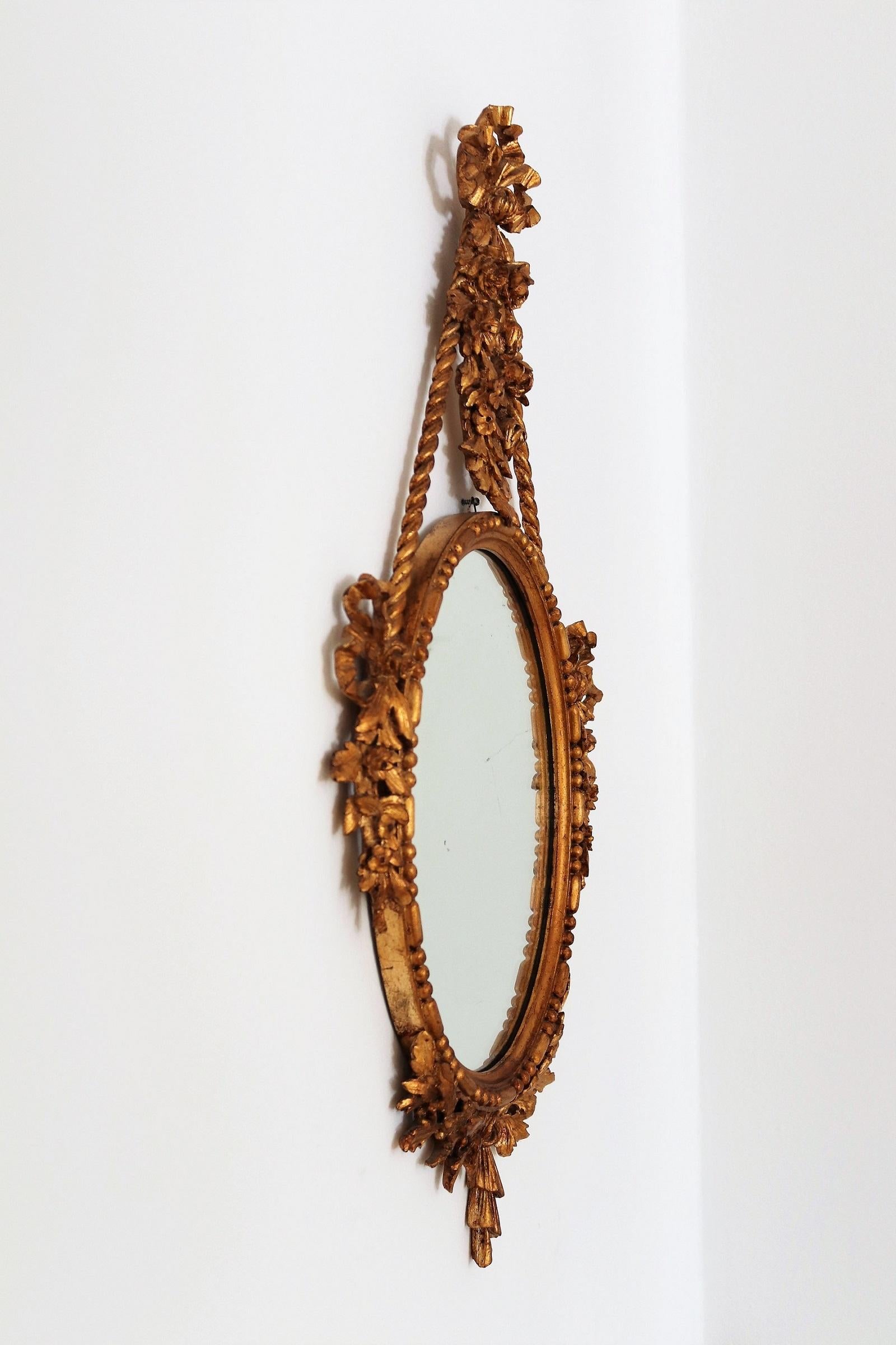 Italian Midcentury Carved Wall Mirror with Gilt Wooden Frame, 1950s 1