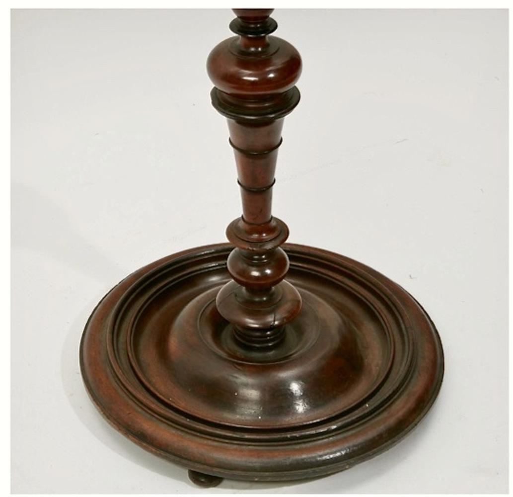 This is a wonderful Continental 18th century pricket stick. The pricket is composed of turned walnut and is sculptural in its turnings. This candle stand is in overall good condition with anticipated minor restoration (as shown in photos) and is