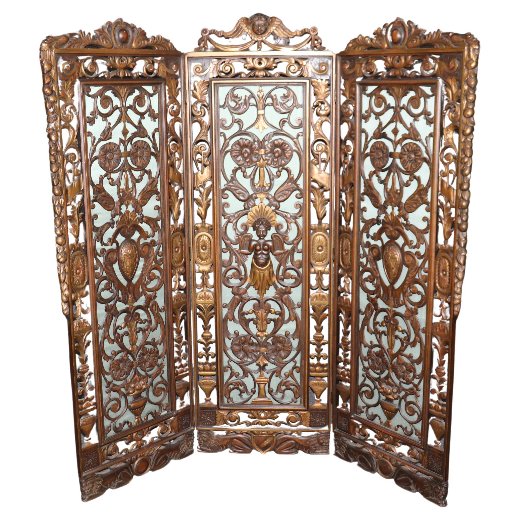 Italian Carved Walnut and Gilded Figural Pierce-Carved Three Panel Screen