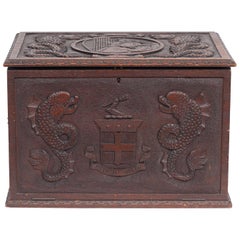 Italian Carved Walnut Captain's Box with Sea Monsters, Coat of Arms and Dolphins