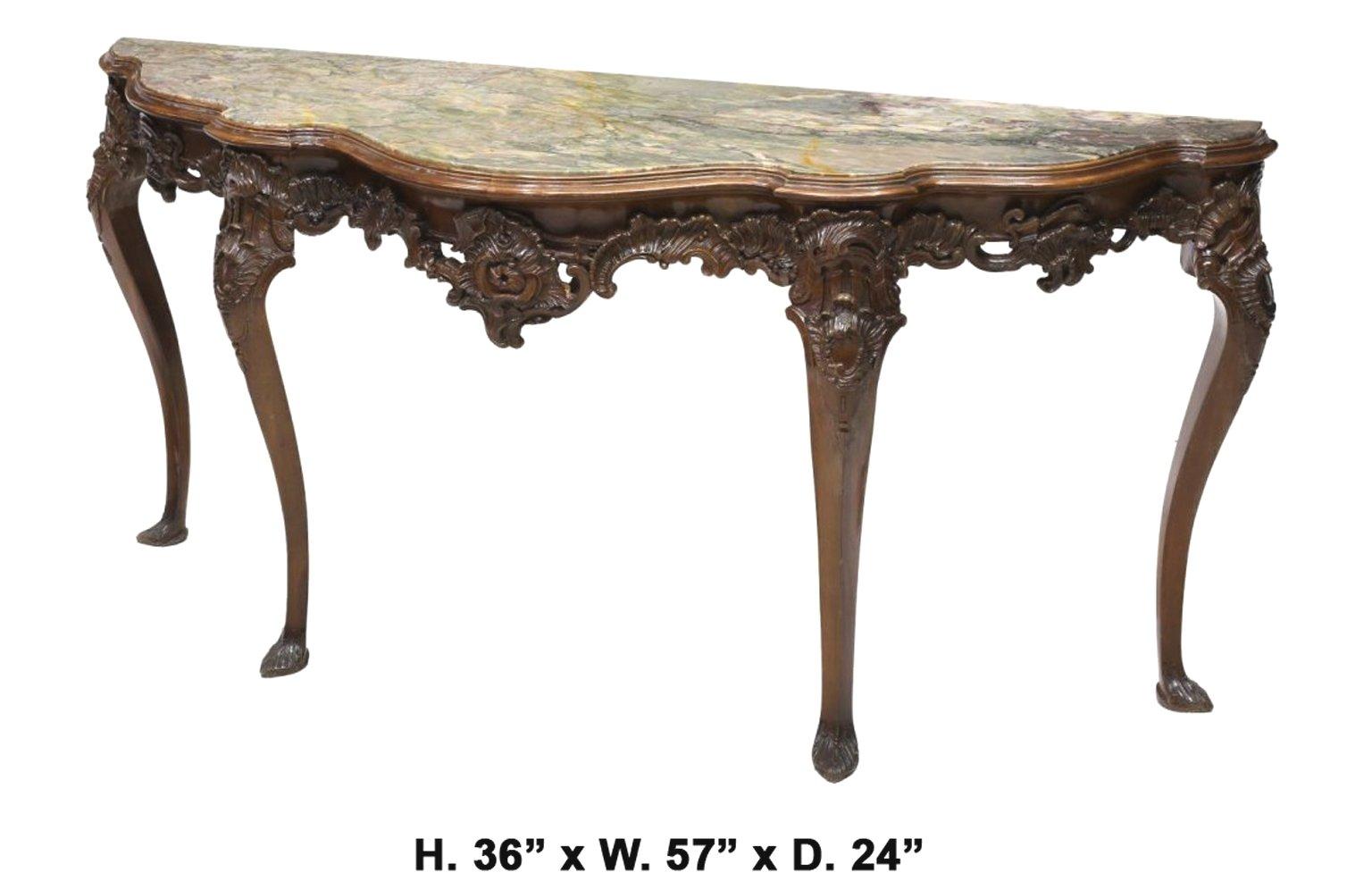 Uniquely shaped 19th century Italian carved walnut long console 
The beautiful exotic serpentine-fronted inset marble top is over Rocaille motif frieze finely carved with foliate C-scrolls, supported by four cabriole legs terminating in carved feet.