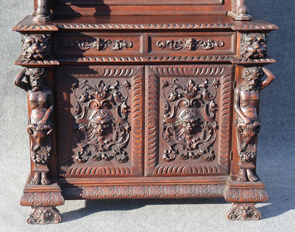 This is an absolutely decadently carved Italian Man of the Mountain huntboard. The piece is two pieces and is in very good antique condition. The piece has more detail than many available online today.
