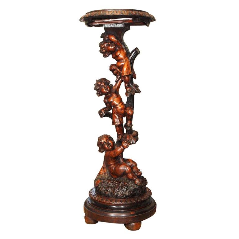 Italian Carved Walnut Stand With Three Putti For Sale