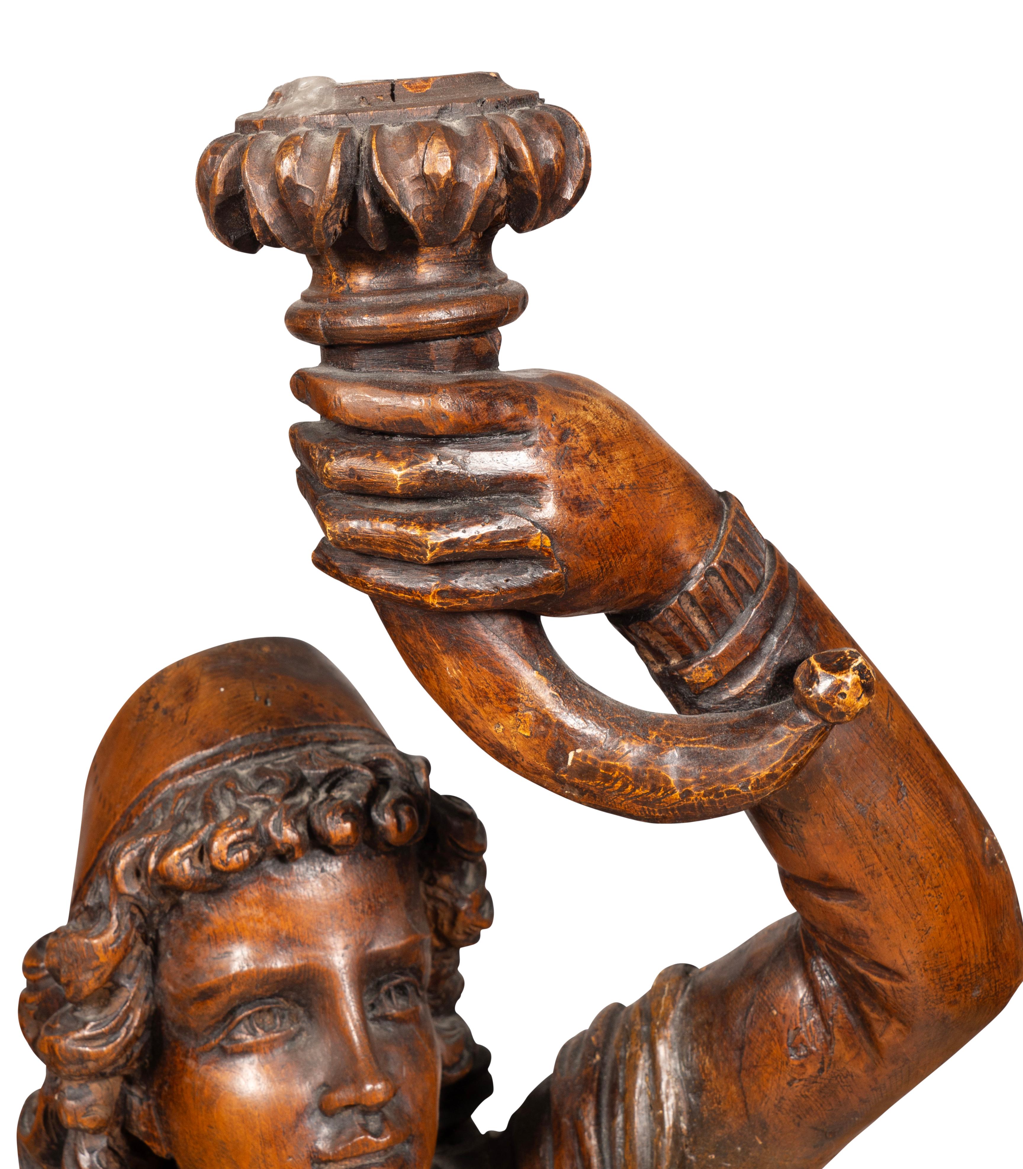 Italian Carved Walnut Torchere Of A Standing Boy Holding A Torch For Sale 7