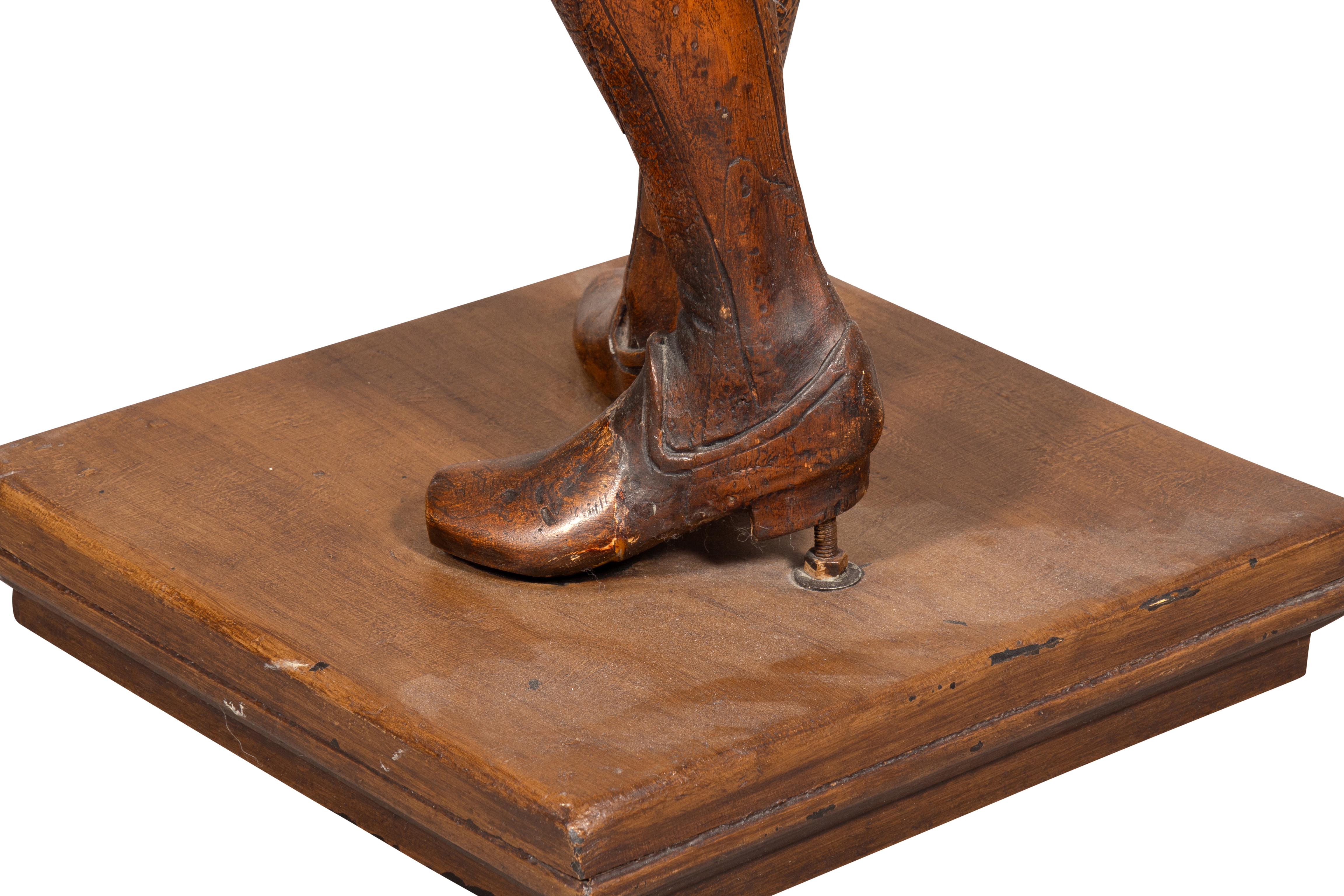 Italian Carved Walnut Torchere Of A Standing Boy Holding A Torch For Sale 1