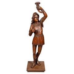 Antique Italian Carved Walnut Torchere Of A Standing Boy Holding A Torch