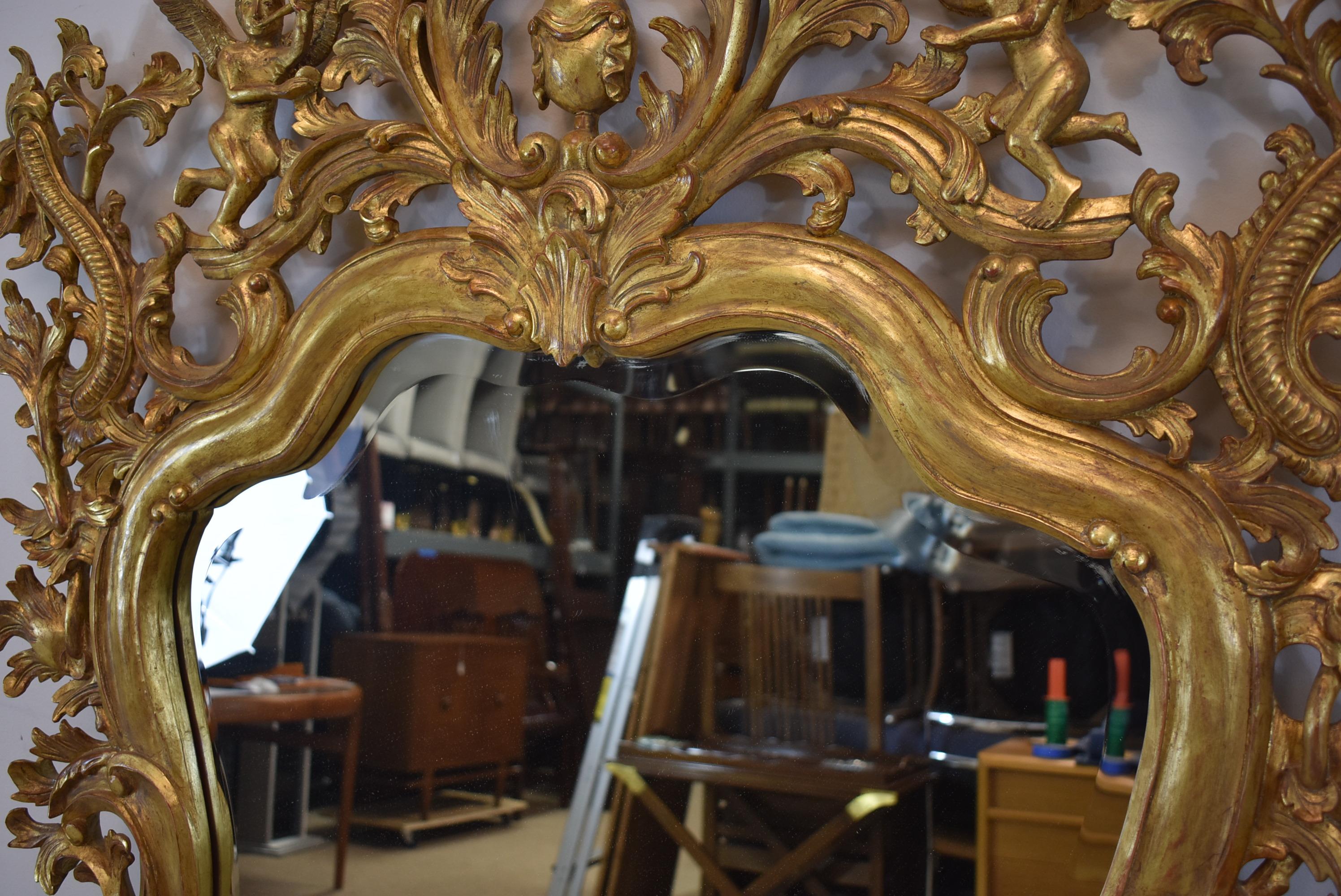 Italian Carved Wood Gold Gilt Trumpeting Angels Beveled Mirror In Good Condition For Sale In Toledo, OH