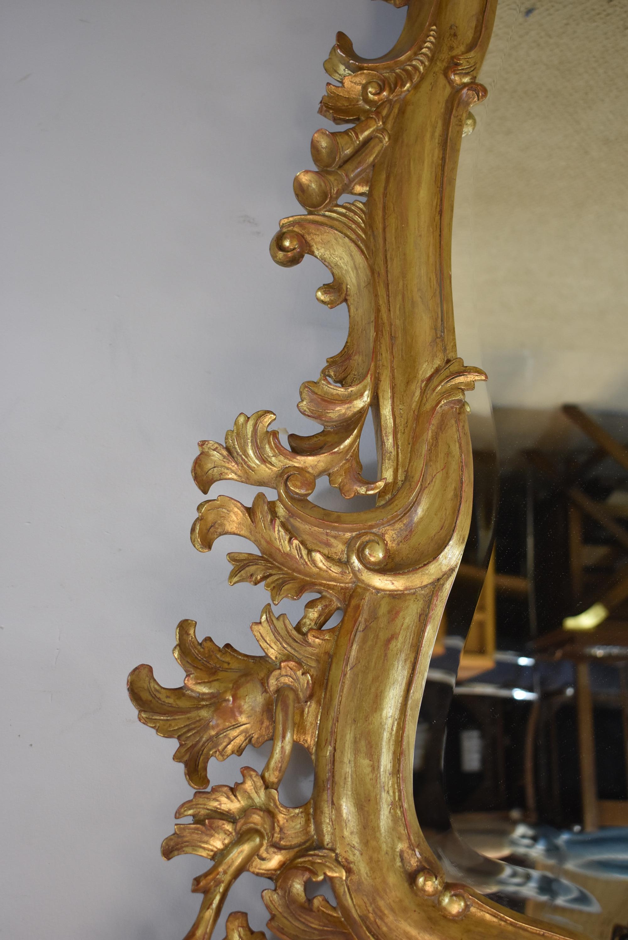 20th Century Italian Carved Wood Gold Gilt Trumpeting Angels Beveled Mirror For Sale