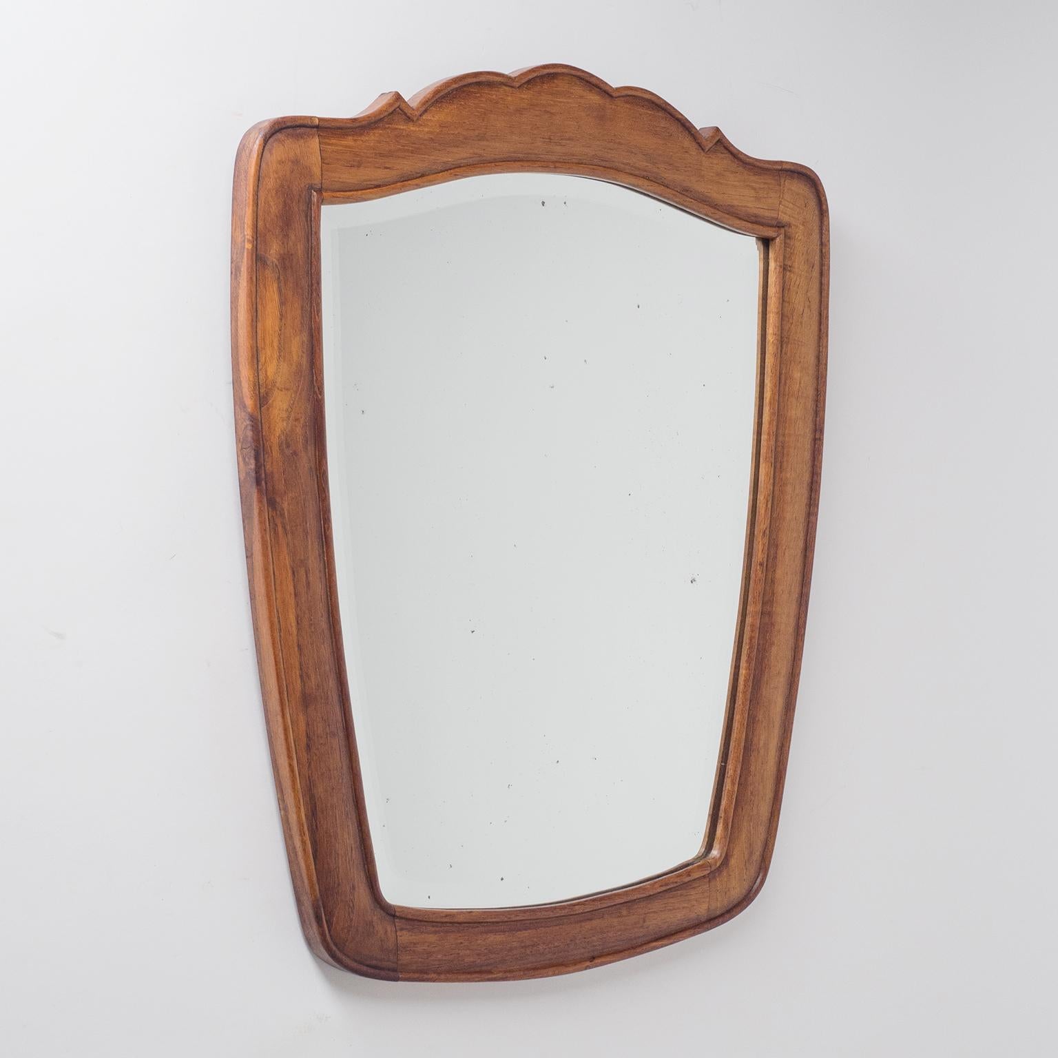 Rare Italian carved wood mirror from the 1930s. Solid hardwood frame with original facetted mirror. Original wall mount has a distance so that mirror will be slightly tilted downward.