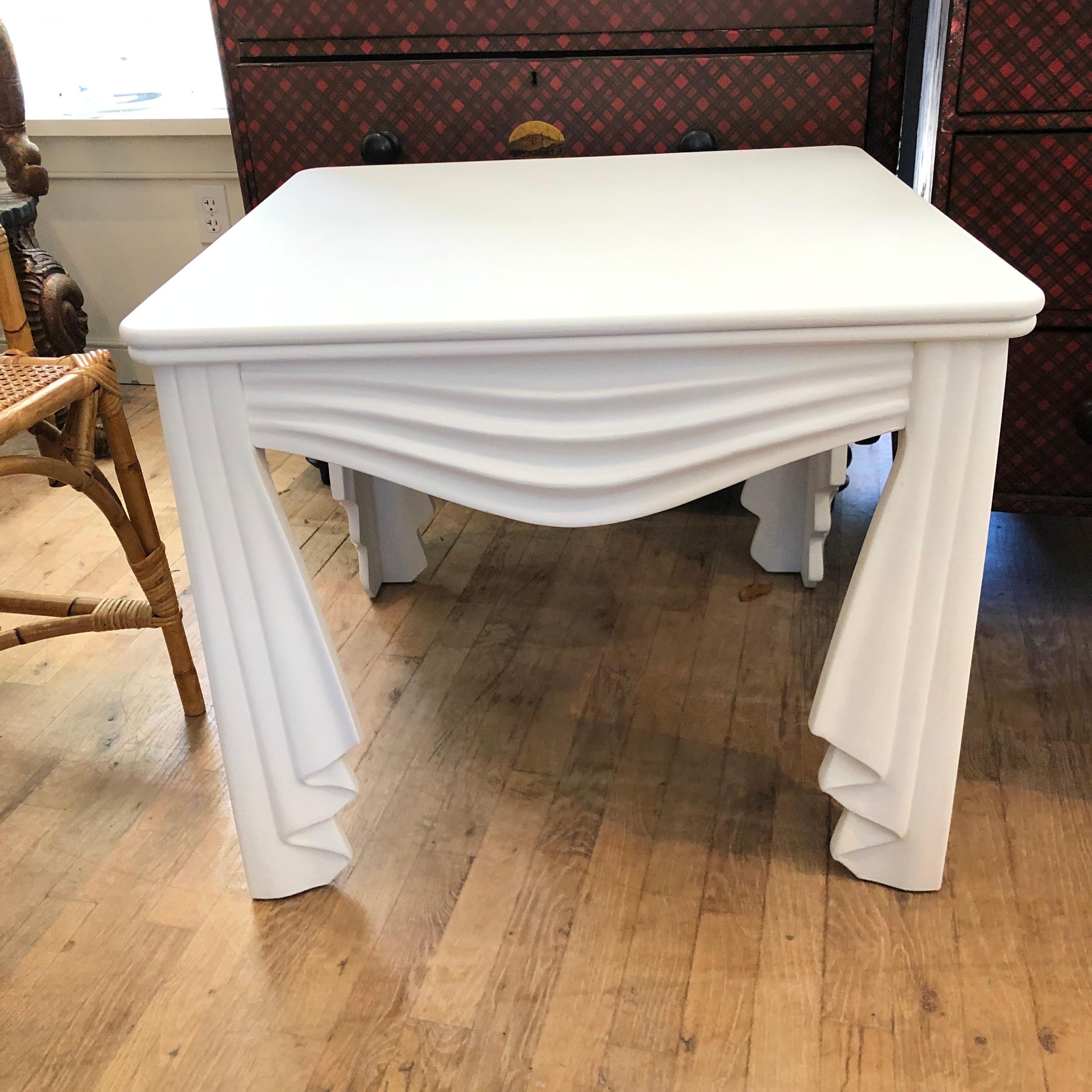 Beautiful faux fabric draped carved wood table newly painted in flat white ... in the style of John Dickinson ....