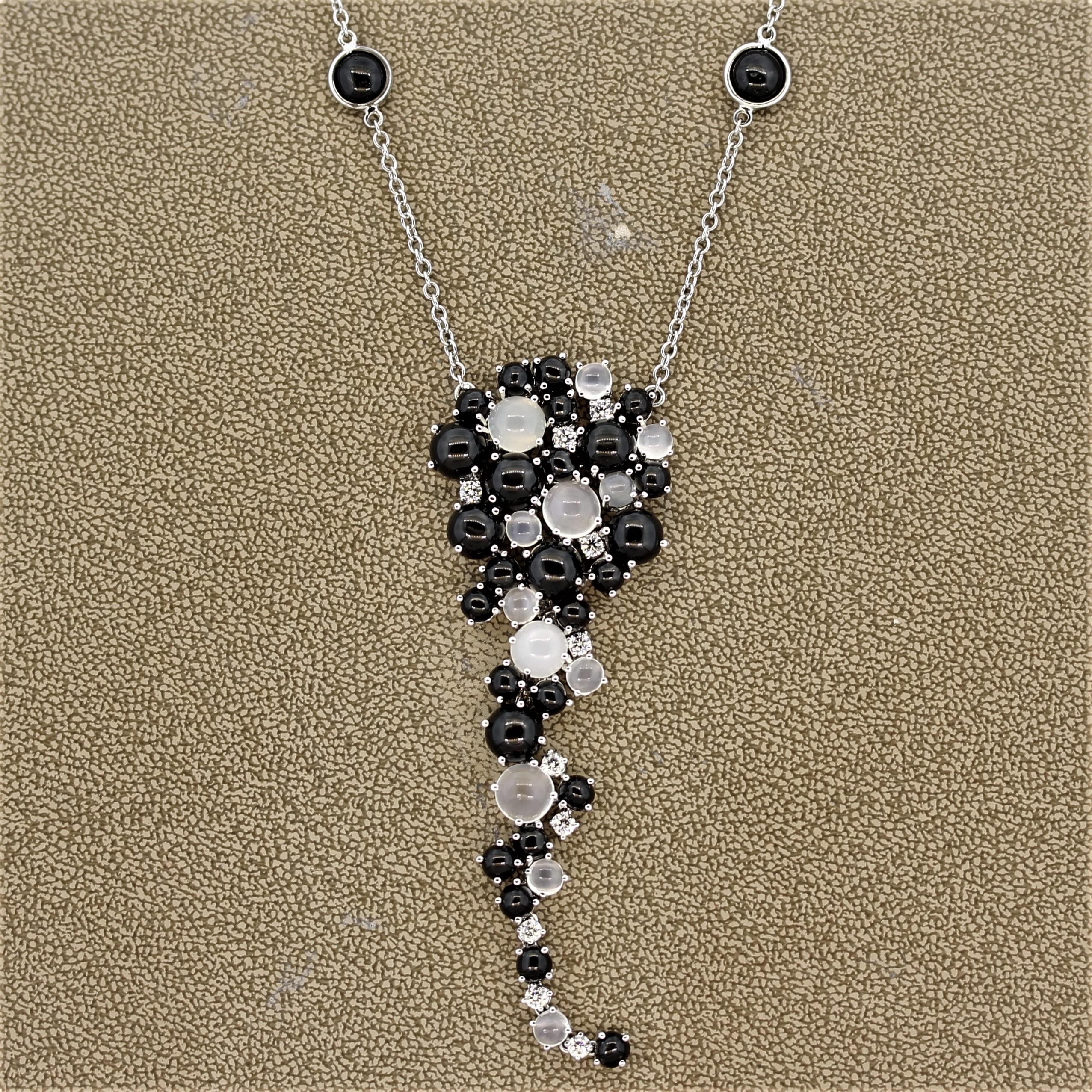 Wow! An Italian made necklace featuring 2 unique gemstones with special phenomenon. They include bright moonstones with a cats eye effect, known as chatoyancy, and black diopside showing a 4 rayed star, known as asterism. The moonstones and diopside