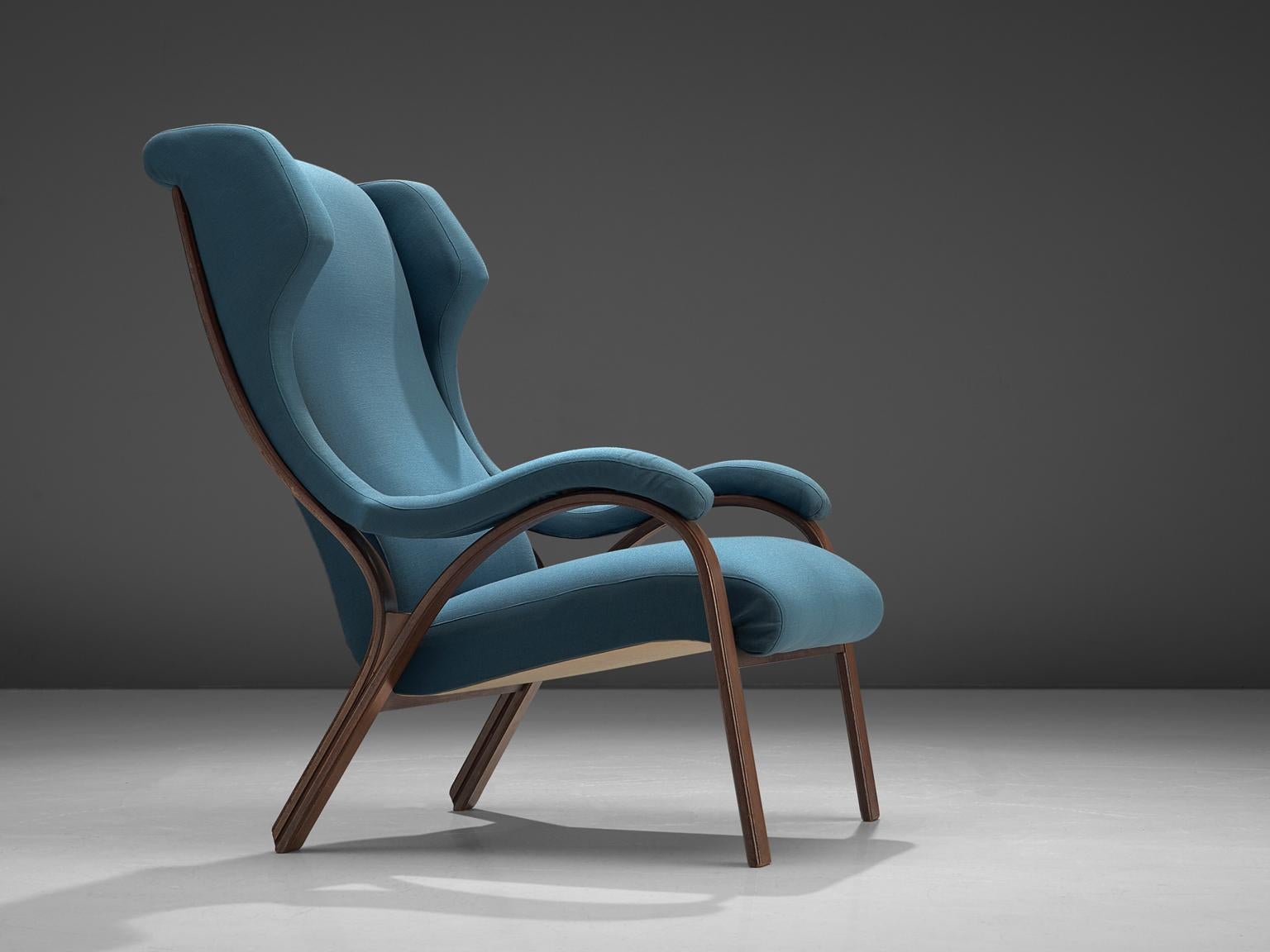 Gregotti, Meneghetti & Stoppino, 'Cavour' easy chair, walnut and blue fabric, Italy, 1959.

This Italian armchair is designed by Gregotti, Meneghetti & Stoppino. The chair features curves and gracious forms. The most interesting feature is the