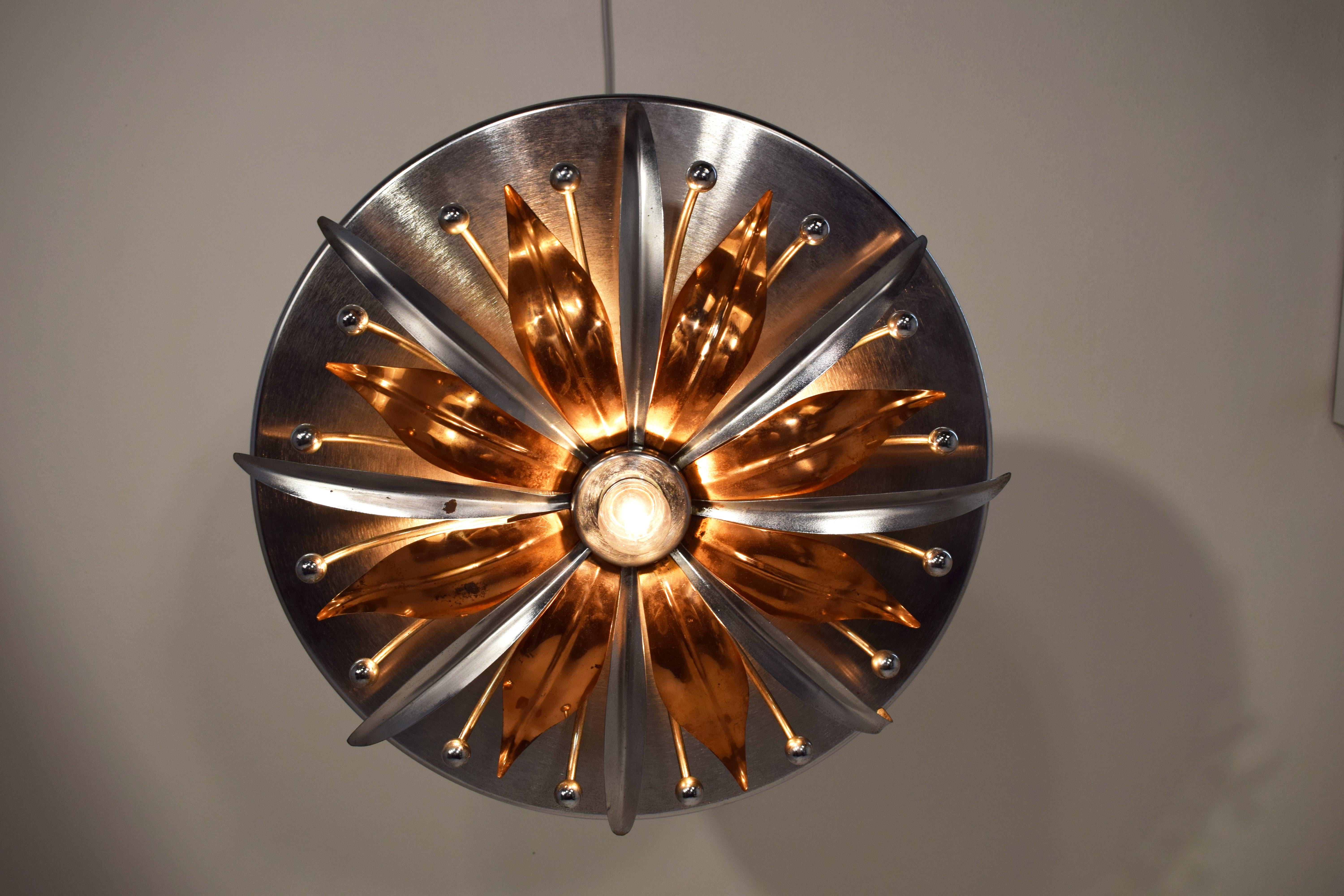 Italian ceiling lamp, steel and copper, 1960s.

Dimensions: H= 15 cm; D= 54 cm.