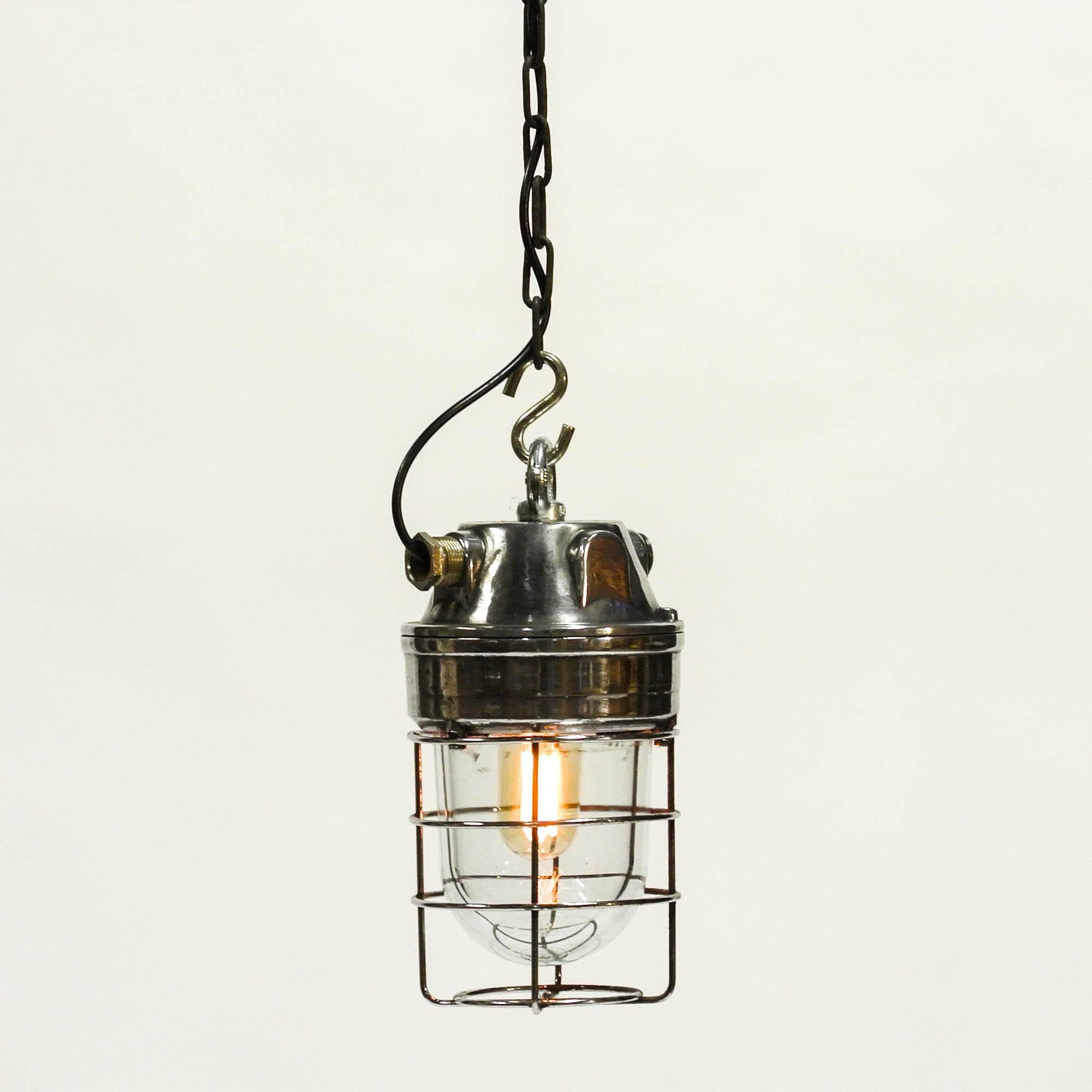 Old Italian ceiling lamp, from chemical industry, fully restored (stripped, brushed, polished, varnished and rewired). Thick explosion-proof glass protected by a steel grid, head lamp in cast aluminium. Nice proportions.

 