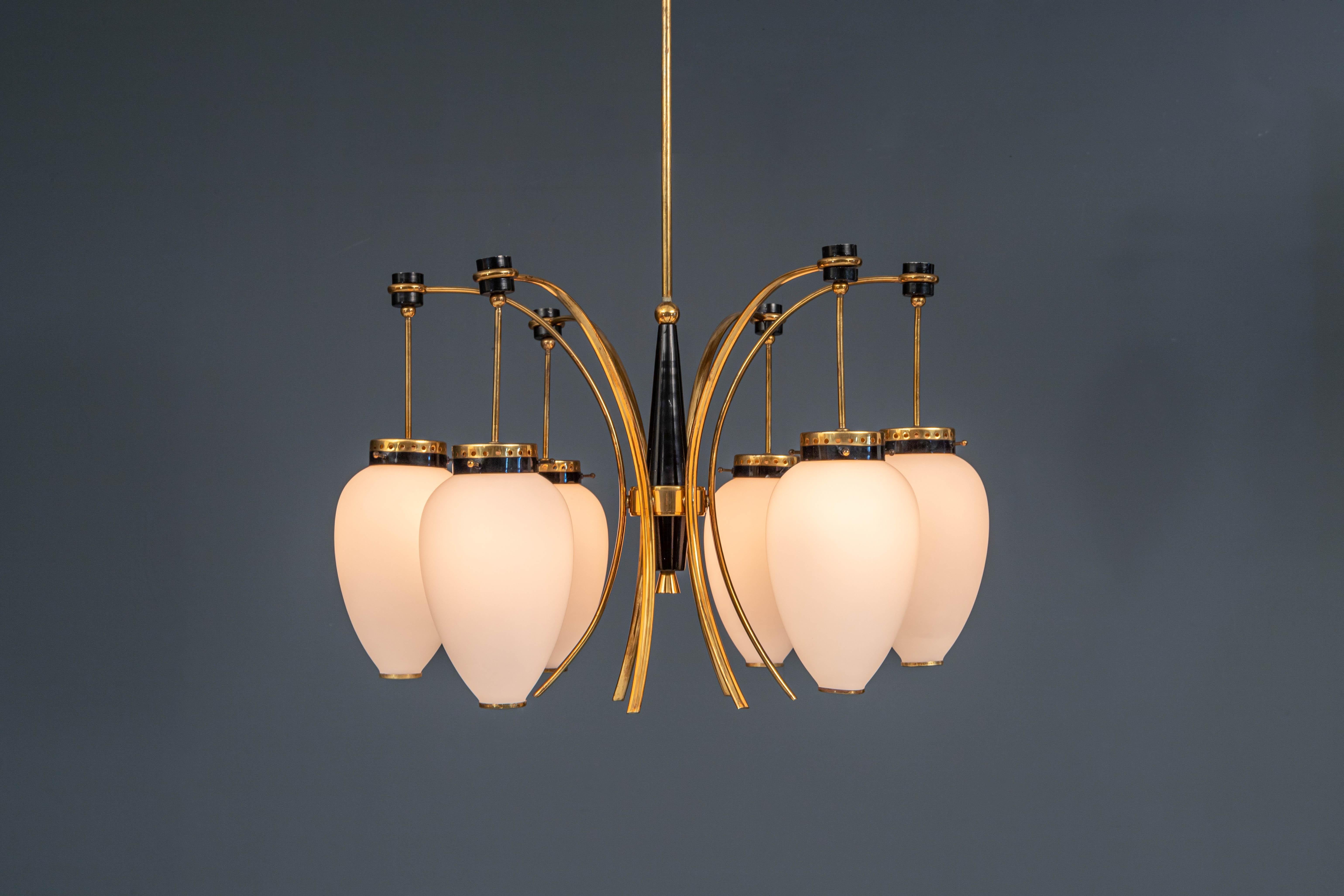 Graceful 1950's Stilnovo ceiling lamp in metal, brass and opaline glass. Great use of colours: The shiny black of the metal and gold of the brass really jump out in this classic piece of art. The cony white opaline glass serves as a good contrast