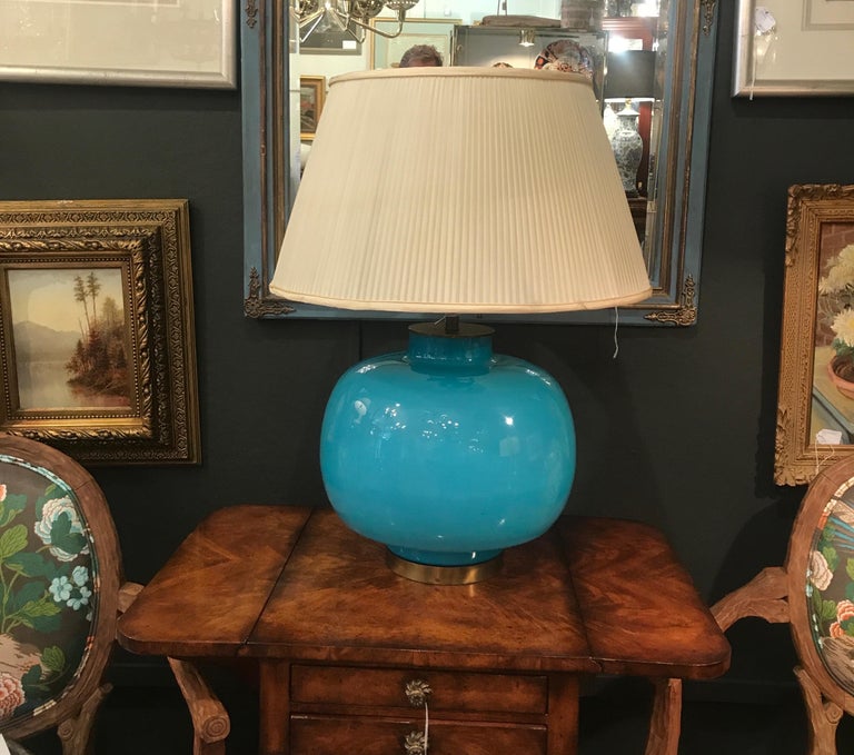 Chic Mid-Century Modern blown glass lamp. Italian Murano glass with a brass top and base. The shade is for photographic purposes only and not included. The lamp measures: 14 inches to the top of the glass and 27 inches with a shade. 15 inches in