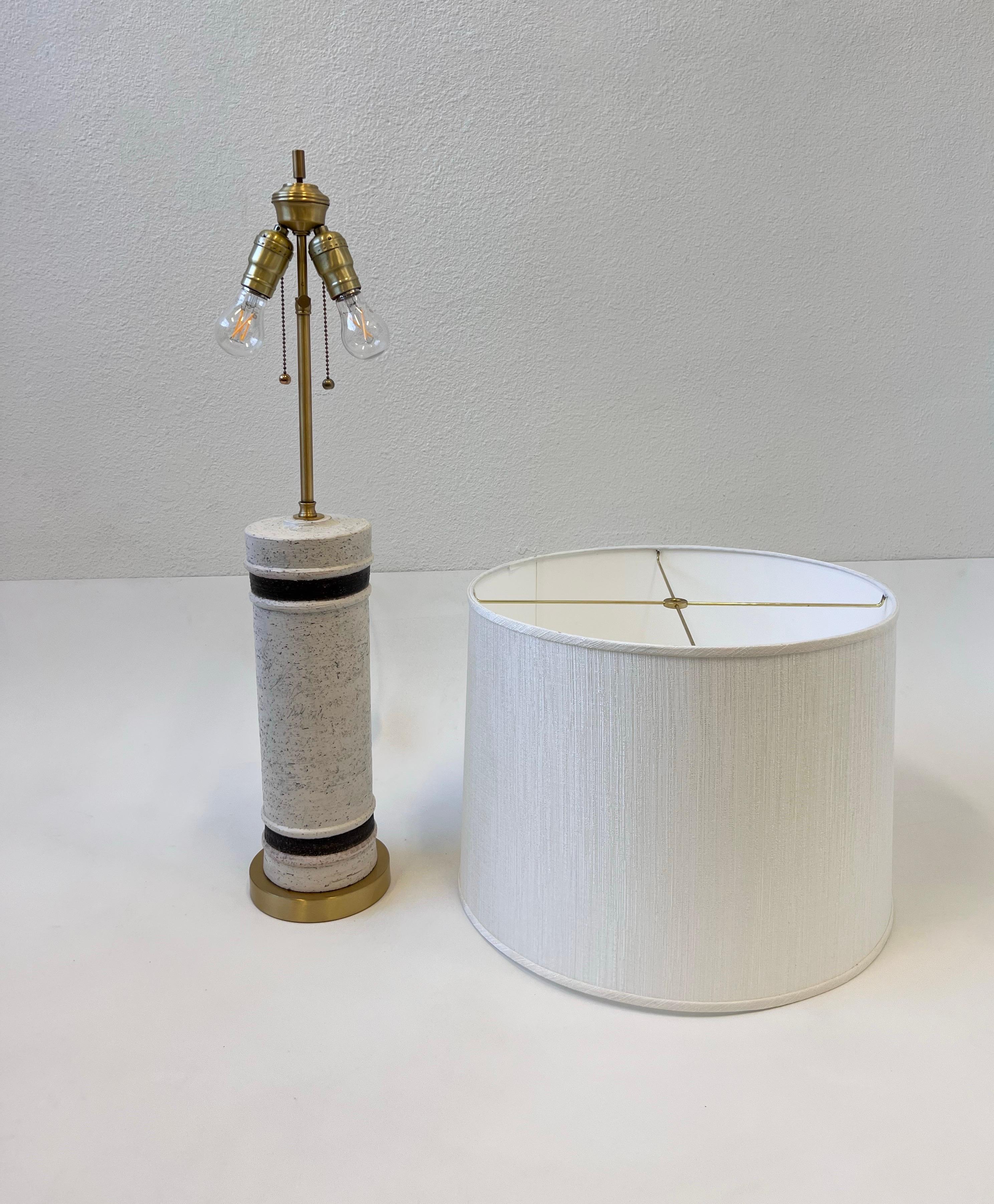 1960’s Italian ceramic and brass table lamp by Bitossi for Bergboms Sweden. 
Newly rewired with satin brass hardware and new white silk shade. 
Constructed of ceramic with white and brown glazed. It takes two 75w Max Edison lightbulbs. 

Base is