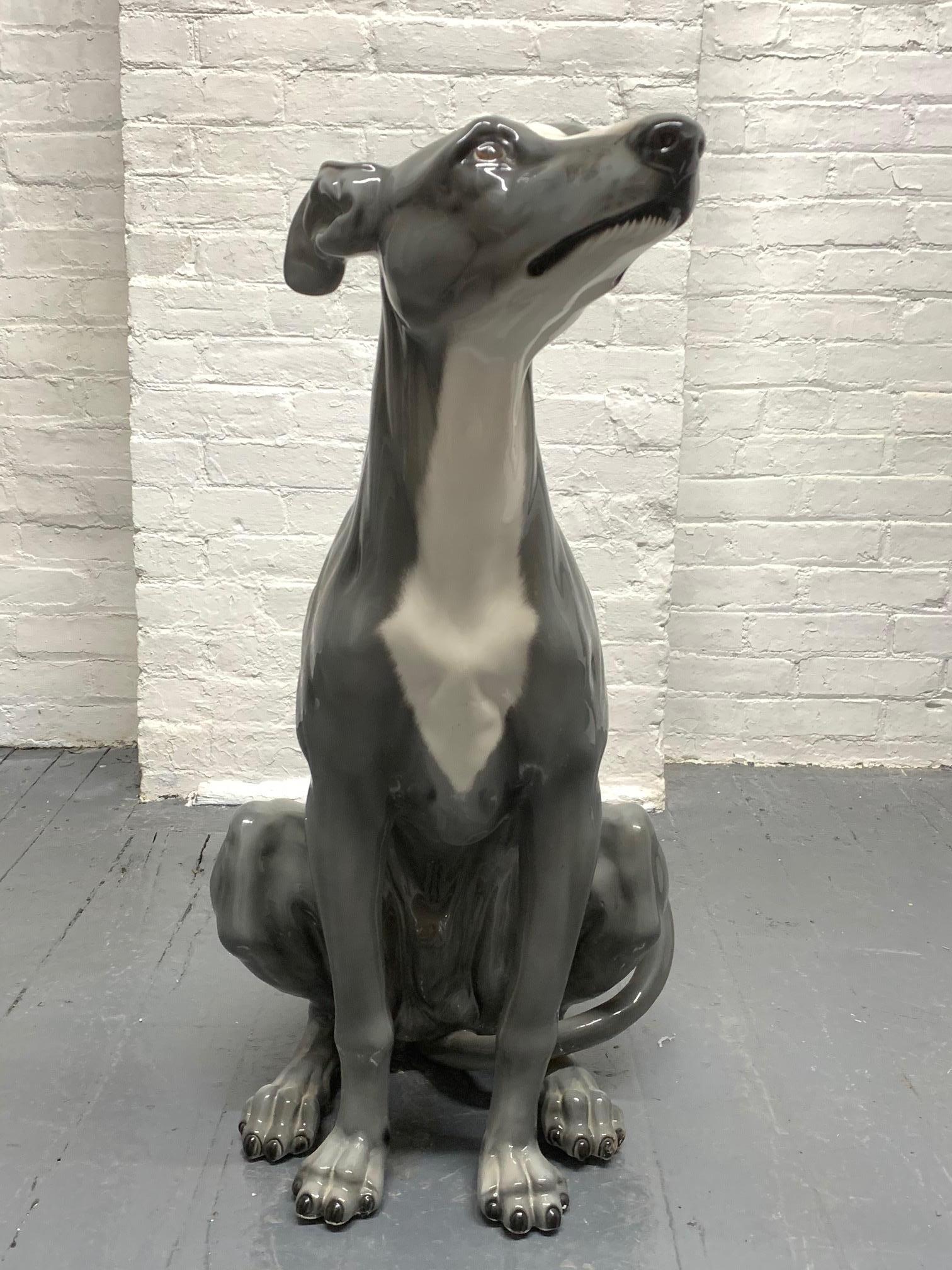 Glazed ceramic sculpture of a dog.