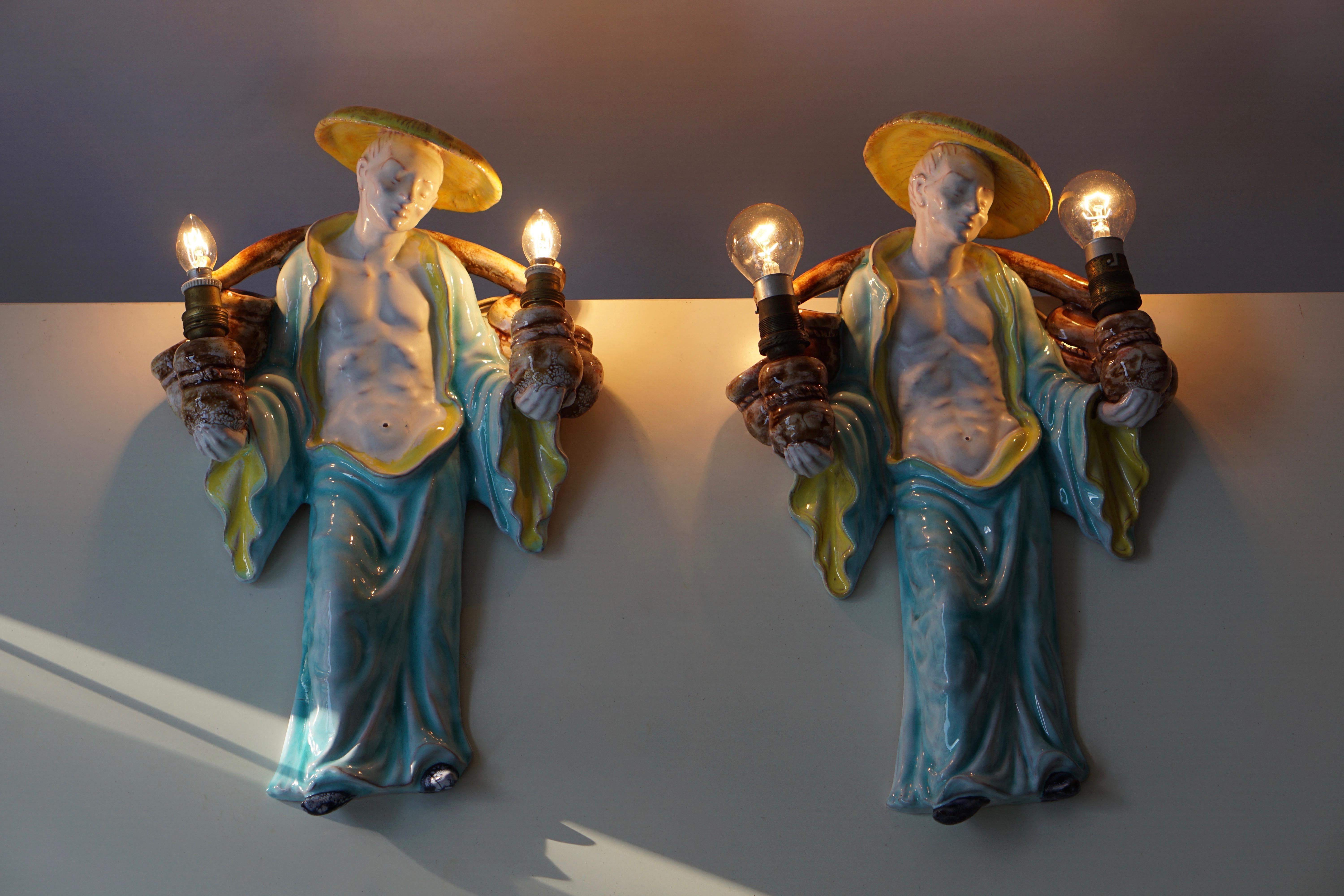 Italian ceramic figural wall mounted sconces or wall lights are made by Lunah, 1967.
Height 44 cm.
Width 27 cm.
Depth 10 cm.