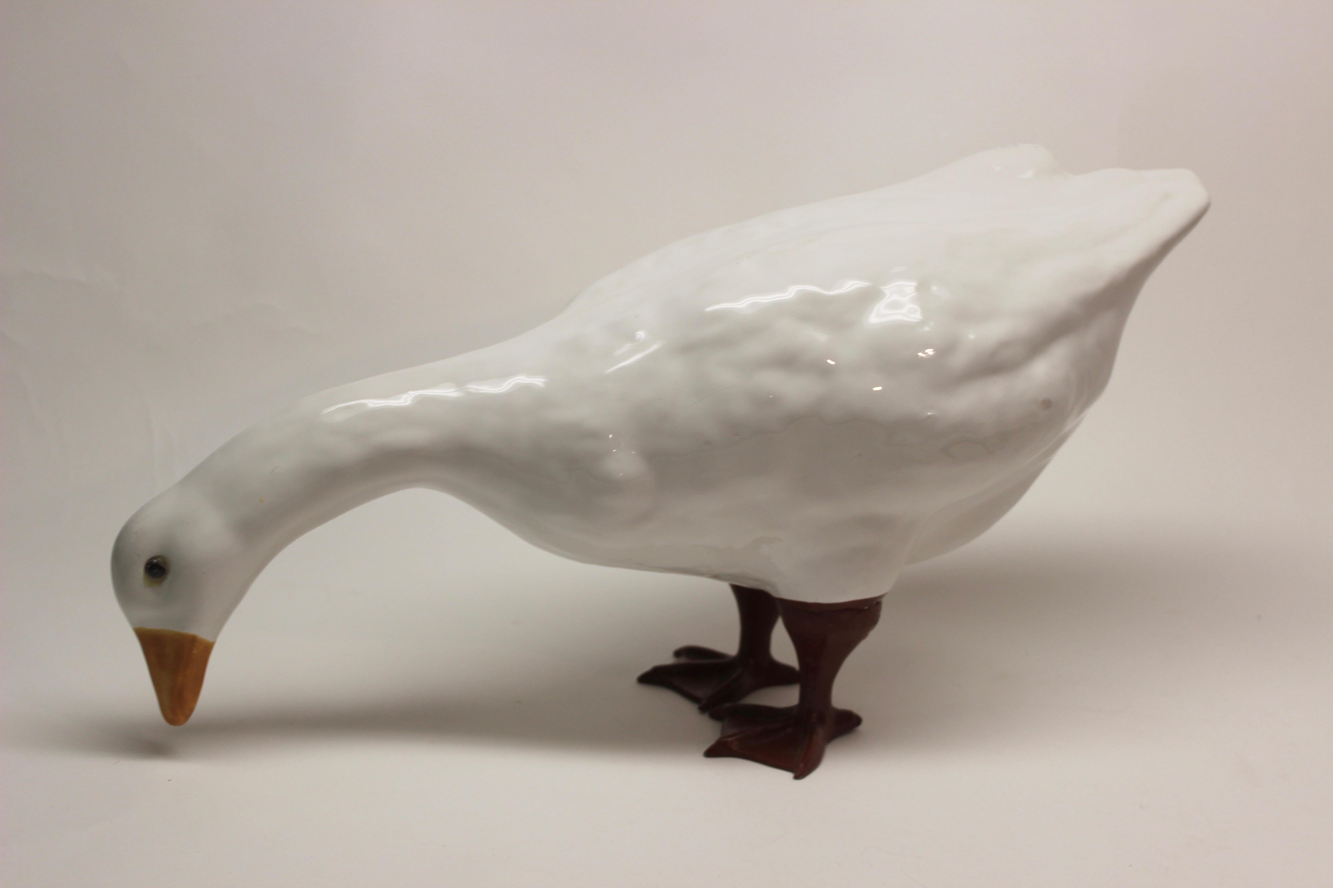 Italian ceramic goose with metal legs, two available.