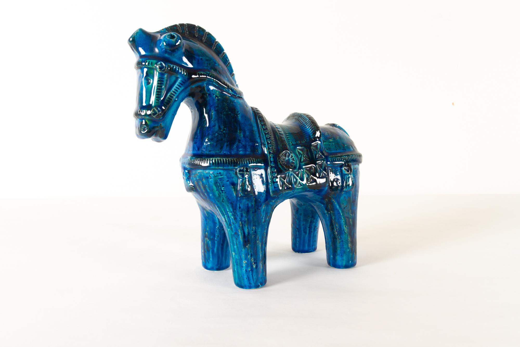 Italian ceramic horse figurine by Aldo Londi for Bitossi 1960s
Sculptural figurine of a saddled horse in Rimini Blu glaze made in Italy. Many beautiful details.
Measures: Height 26.5 cm
No damages.
