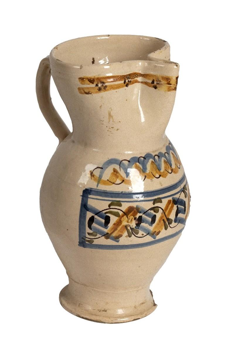 This is a ceramic jug handmade in southern Italy, exactly in Puglia, at the end of the 19th century. This precious decorative object has color decorations and a handle.

Dimensions: cm 37 (height).

This object is shipped from Italy. Under