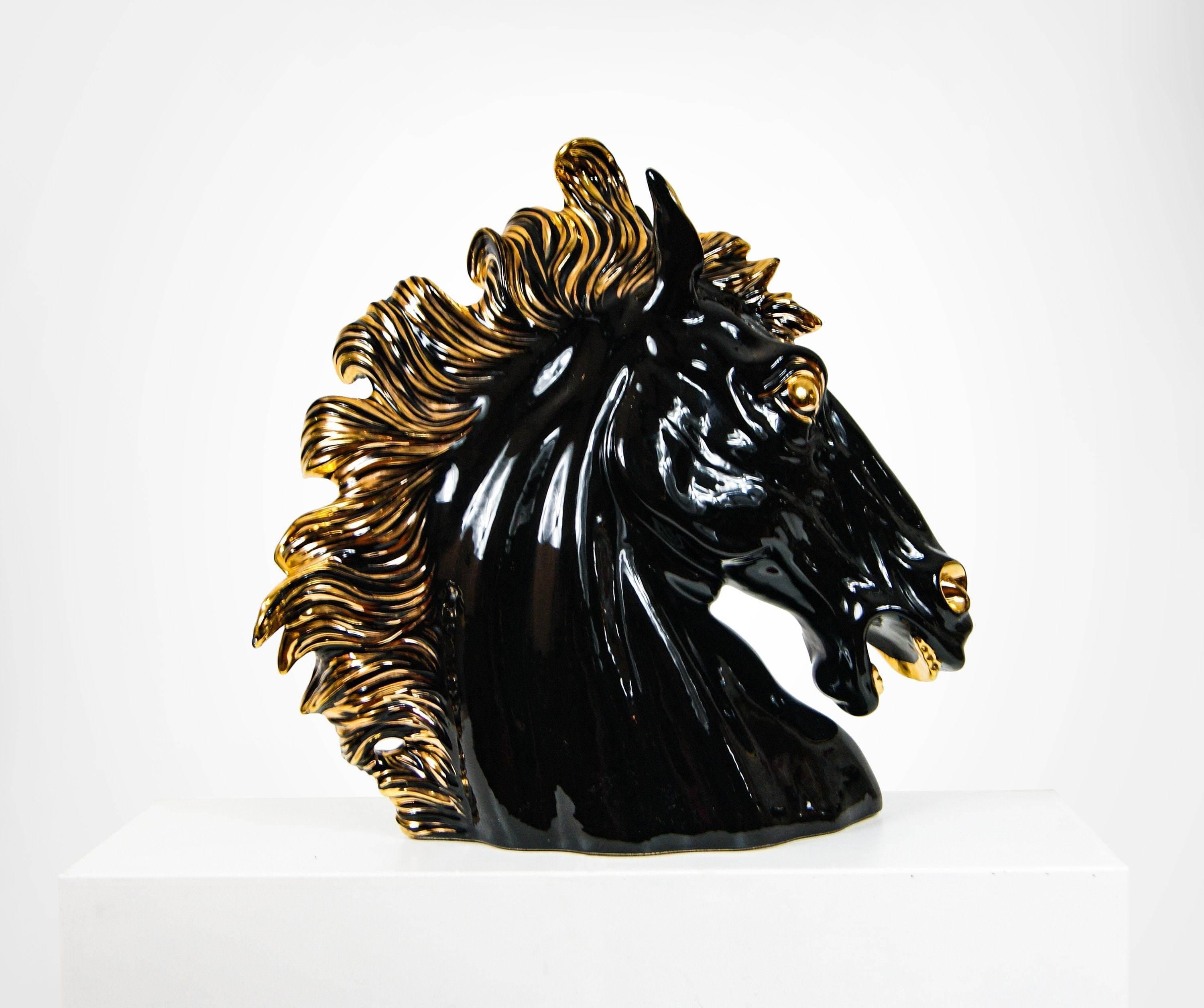 Monumental Italian ceramic stallion horse head sculpture dating from the early 1990s.
Impressive high gloss glazed ceramic horse head, in colours black and gold.
It will make a great addition to most modern interior settings.
In very good vintage