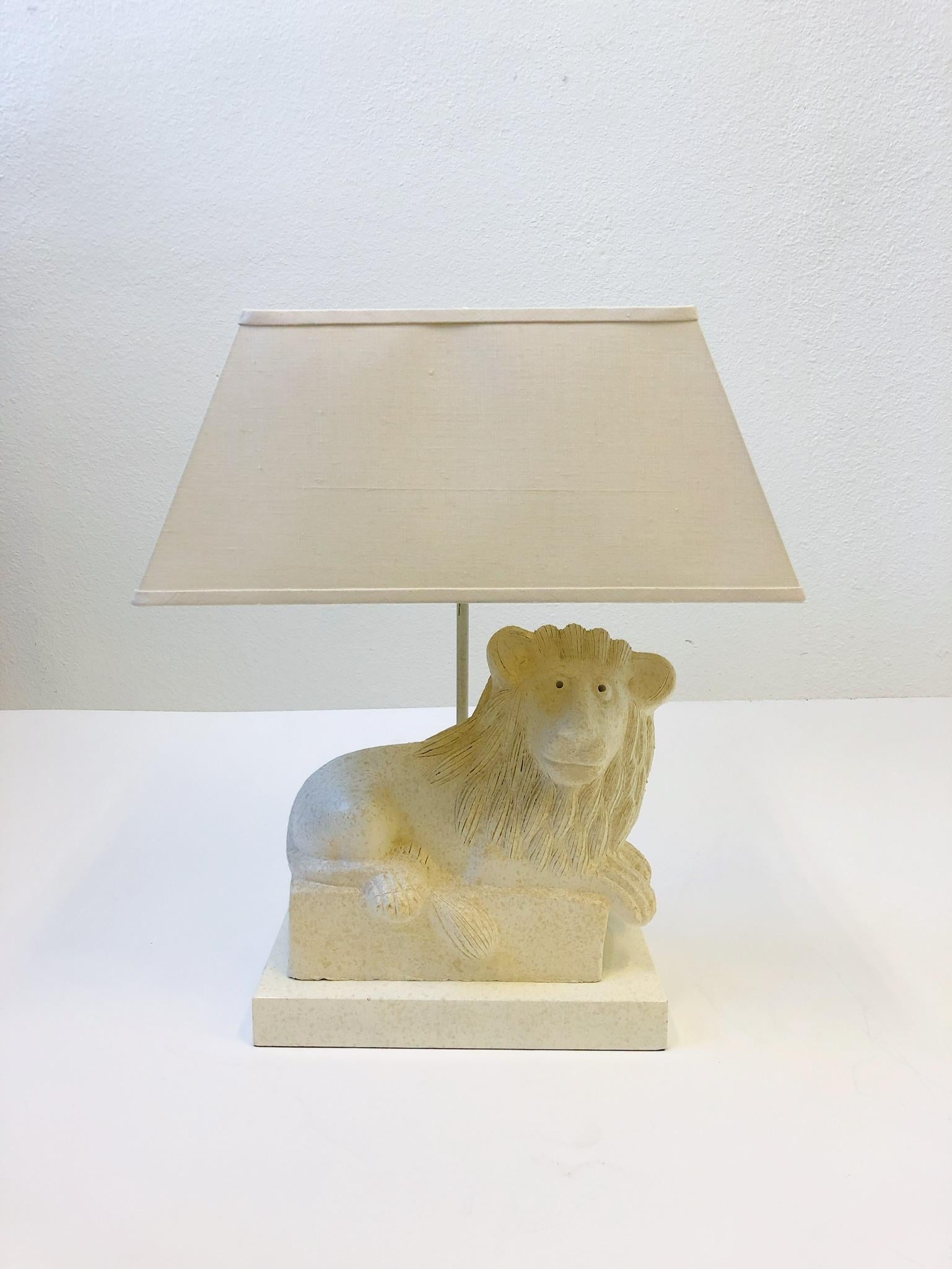 A spectacular custom lacquered finish Italian ceramic Lion table lamp by Steve Chase. The Italian ceramic lion is by Bitossi. This lamp was custom order by Steve Chase for a project in Rancho Mirrage. The shade is the original vanilla linen shade so