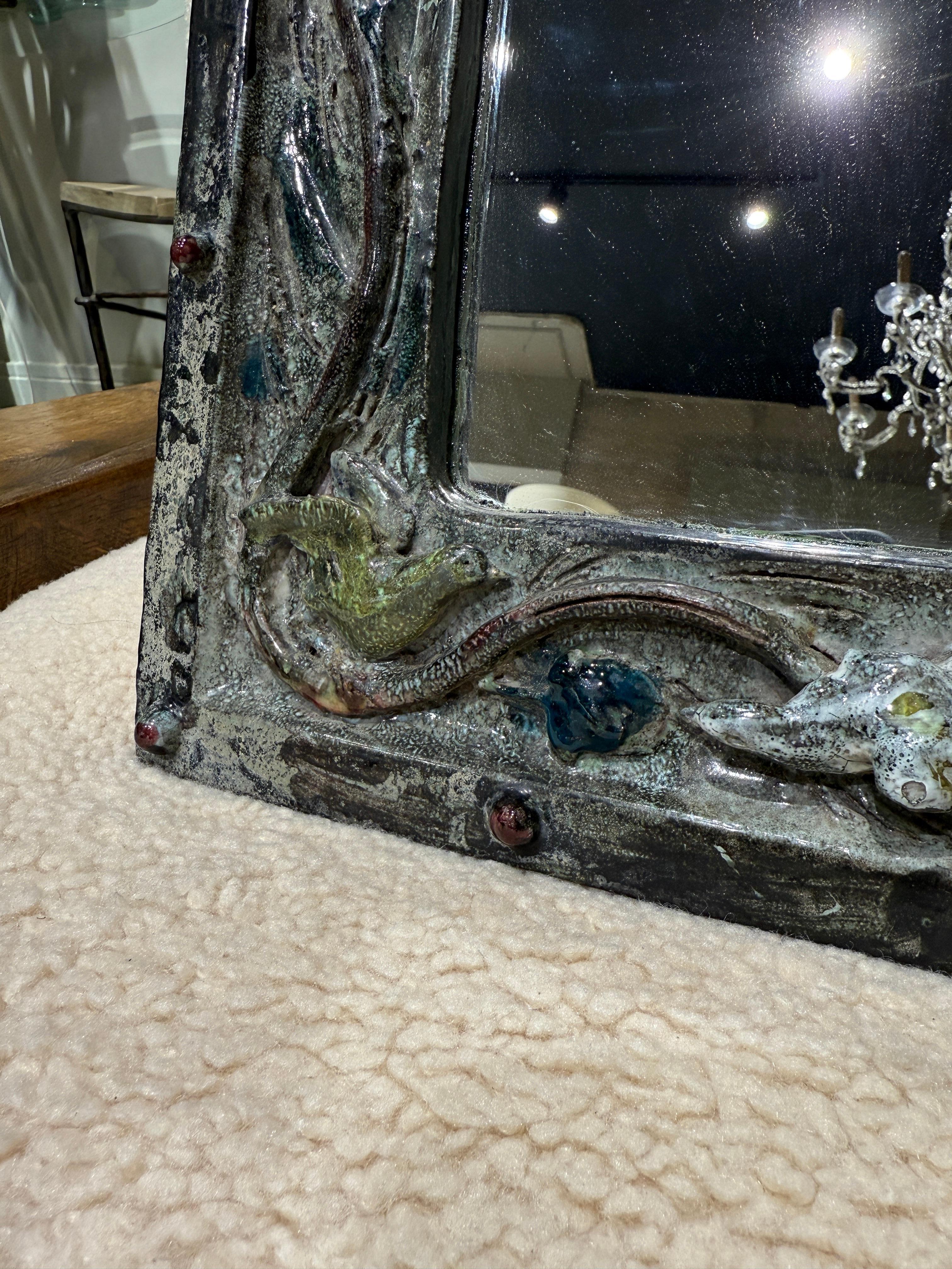 Italian ceramic mirror circa 1950
nice details 

Size is 
H 50 cm
W 40 cm 
