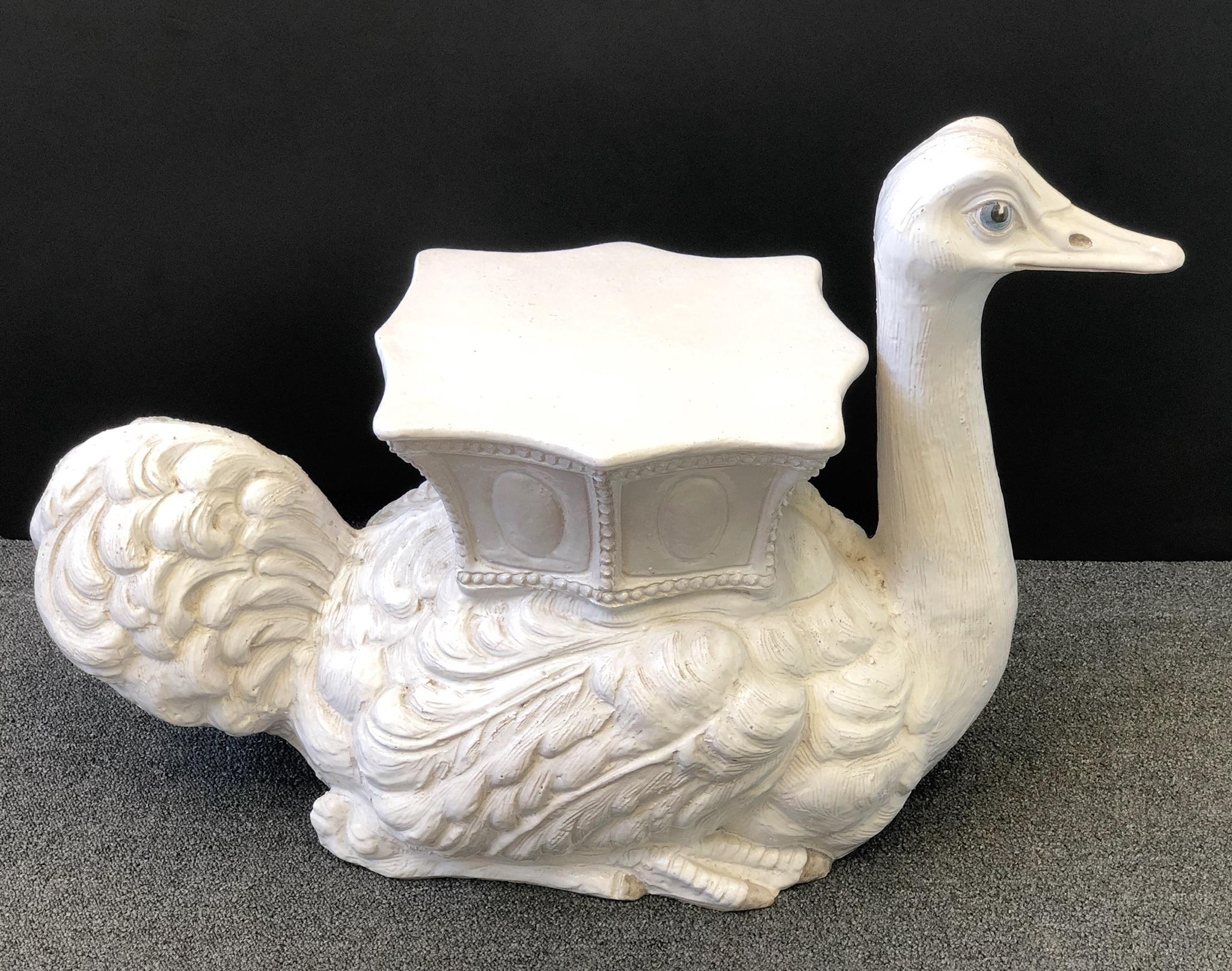 A fabulous white glazed ceramic ostrich garden seat or side table from the 1960s. The ostrich is made out of terracotta and hand painted white glazed. Marked Italy in the underside.
Overall dimensions: 20” high 31” wide 15” deep 14.25” seat.