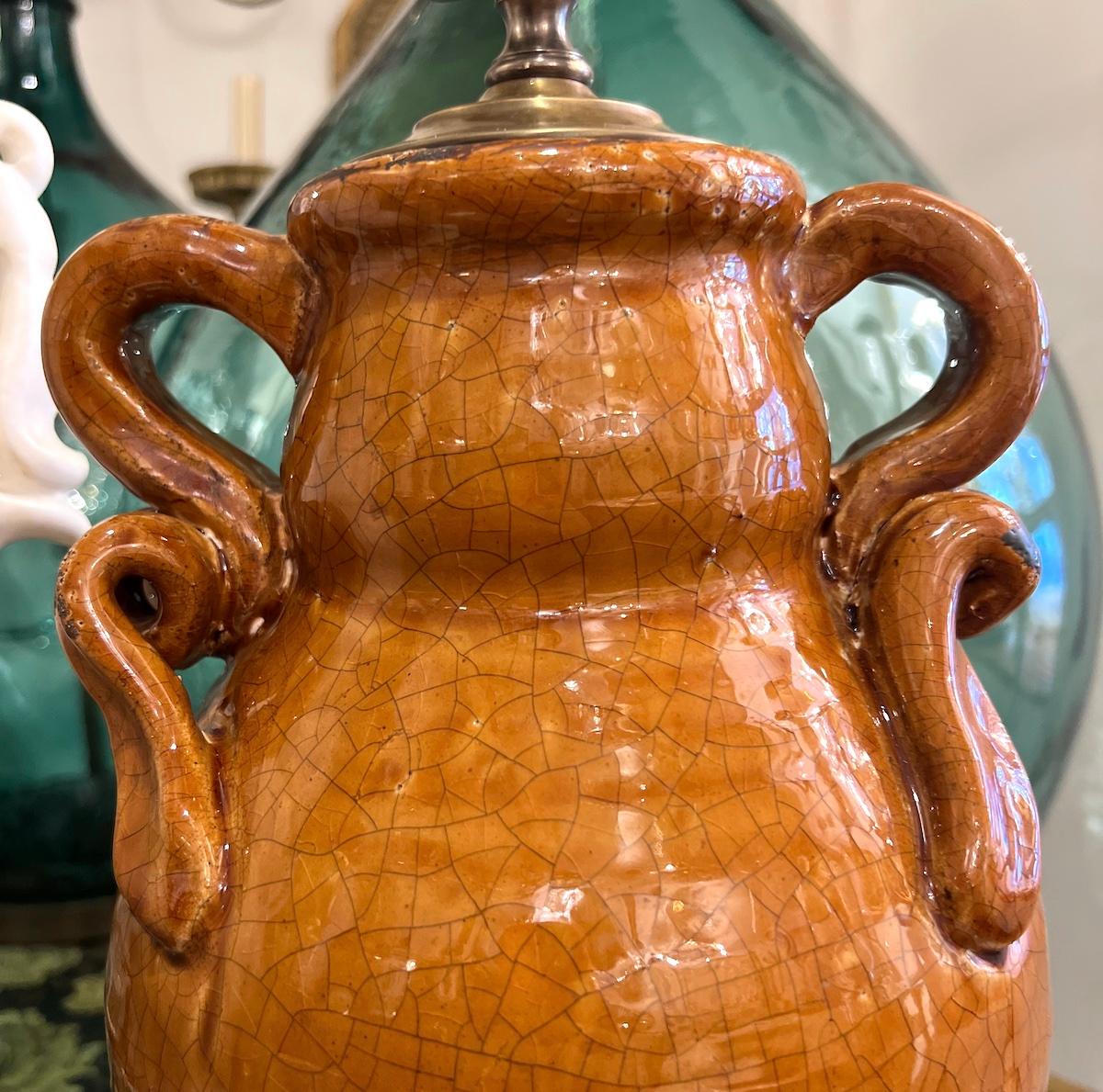 A crica 1950's Italian ceramic table lamp with wooden base.

Measurements:
height of body: 17