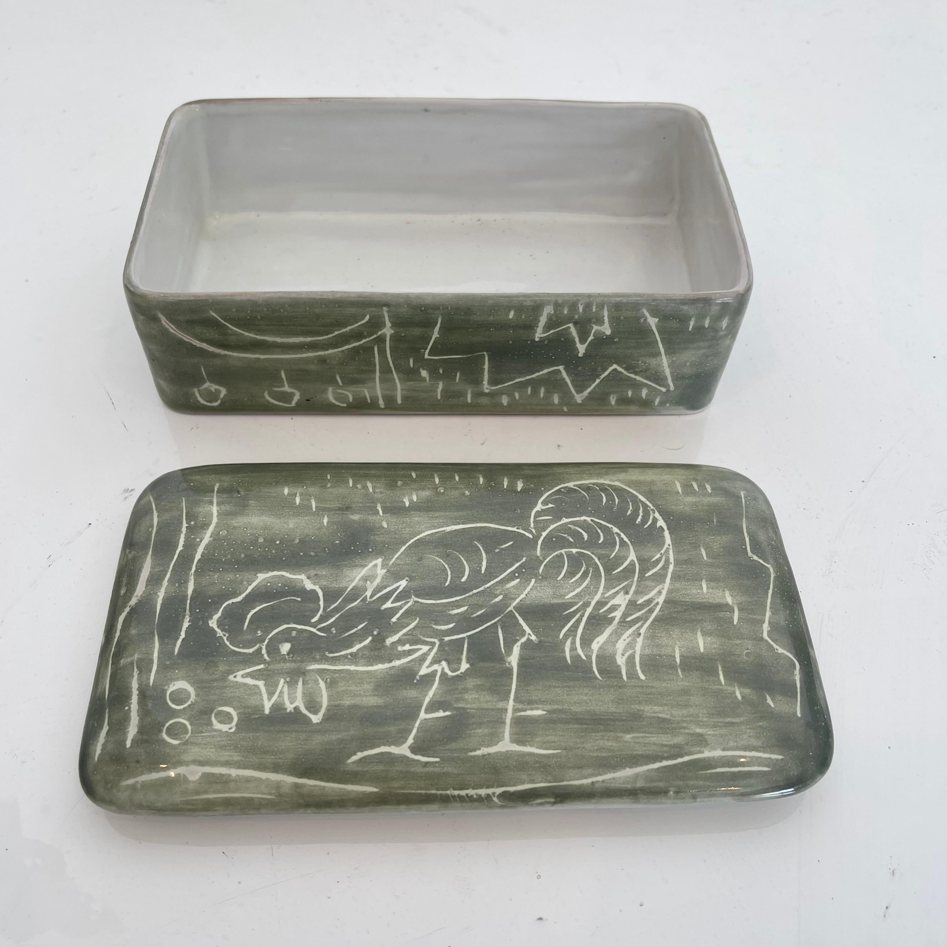 Green ceramic box made in Italy. Drawing of a rooster etched into the box. Great small piece of art. Perfect stash box and tabletop object. Marked Arlero, Italy on underside.