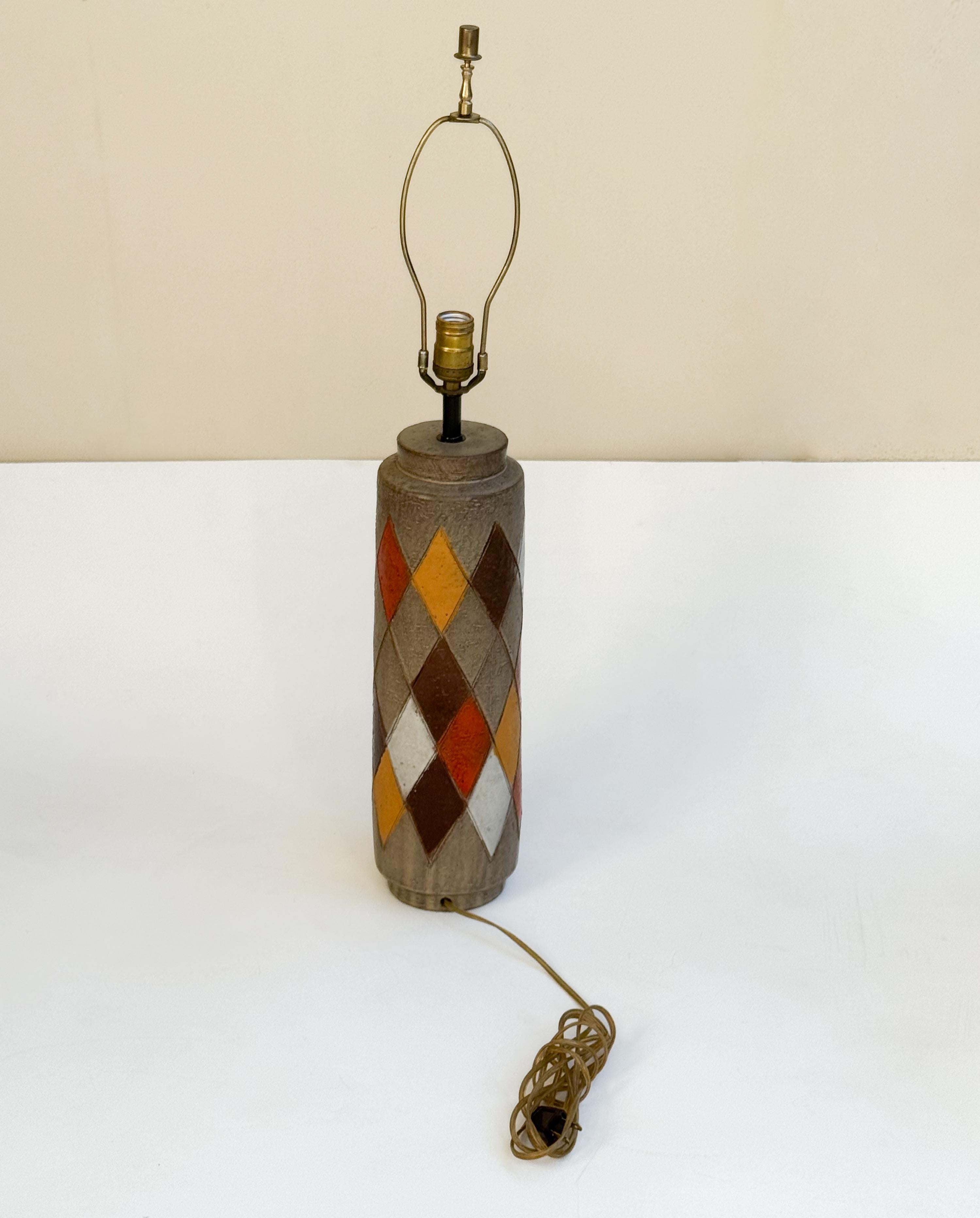 1970’s Italian ceramic and brass table lamp by Bitossi. 
Newly rewired for US, new vanilla linen shade, wire and socket, that takes 100w max Edison bulb. Ceramic base is in great vintage condition. 

Measurements: 
31” High, 5.5” Diameter, 18”