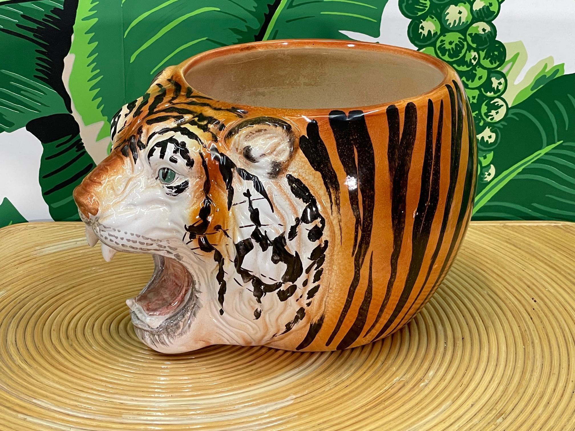 Large ceramic cachepot or bowl made in Italy features a sculptural tiger head motif and a bright, glossy glazed finish. Good condition with minor imperfections consistent with age, see photos for condition details
For a shipping quote to your exact