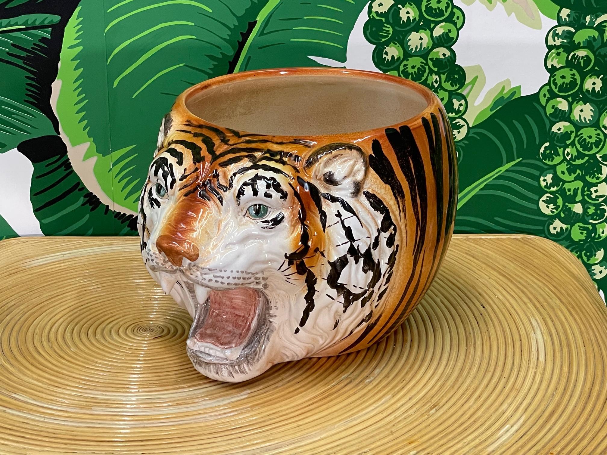 Large ceramic cachepot or bowl made in Italy features a sculptural tiger head motif and a bright, glossy glazed finish. Good condition with minor imperfections consistent with age, see photos for condition details. Some staining inside.
For a