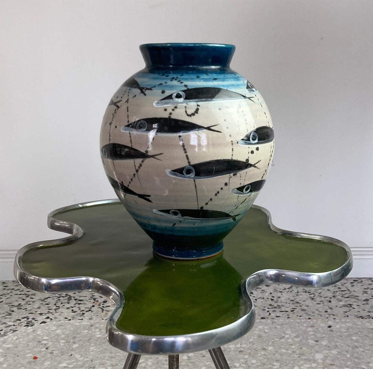 Beautiful handmade ceramic vase turned and decorated by Lucio Liguori, with characteristic “Alici’ theme.

Bio:
Located in Raito, a few steps from Vietri sul Mare, there is the laboratory of Lucio Liguori, the most important ceramist of the