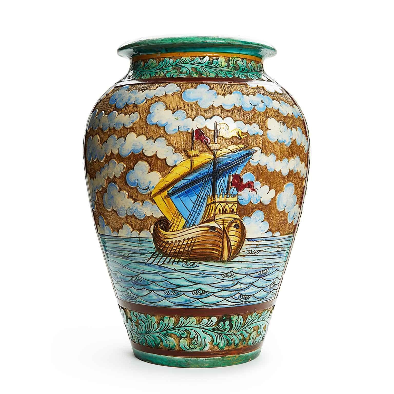 A stunning large Italian vase, suitable for flowers or umbrella stand, an Italian Ceramic artwork decorated in Relief  with a sea landscape , vessels and clouds. The vase has two turquoise floral bands, one upper and one lower with raised and