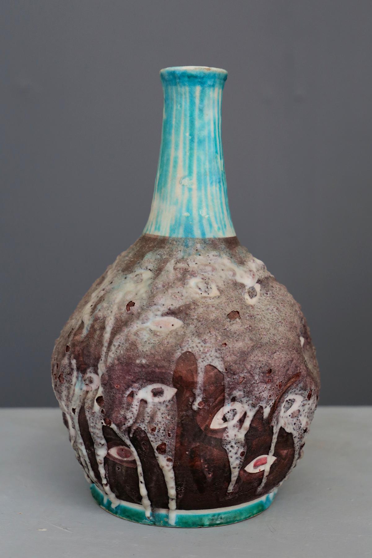 Vase in C.A.S. Vietri glazed ceramic, with a motif that recalls the shape of a human eye, the vase is made with a technique: thrown by hand with blue and white salt glaze. Signed on underside. The ceramic factory 