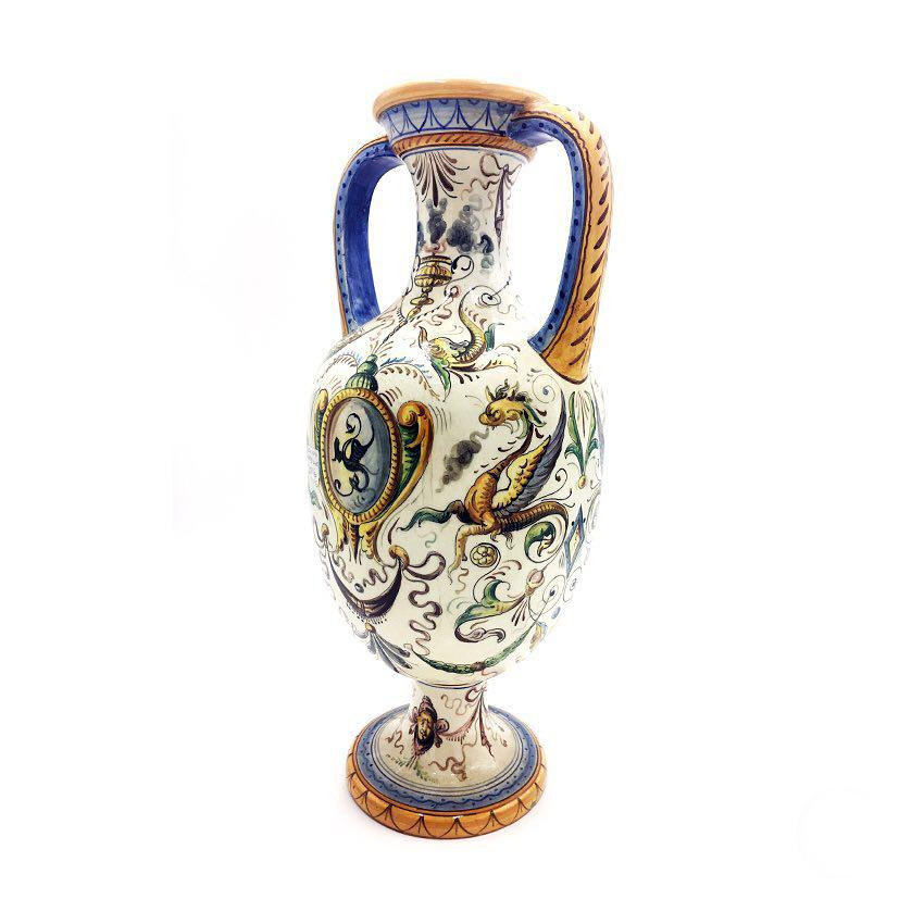 Italian ceramic vase painted with a raphaelesque motif, 1960s
The vase from 1960s, is composed of the central cup with two curved handles.
Good condition
Measures: 30 x 55 H cm.
  