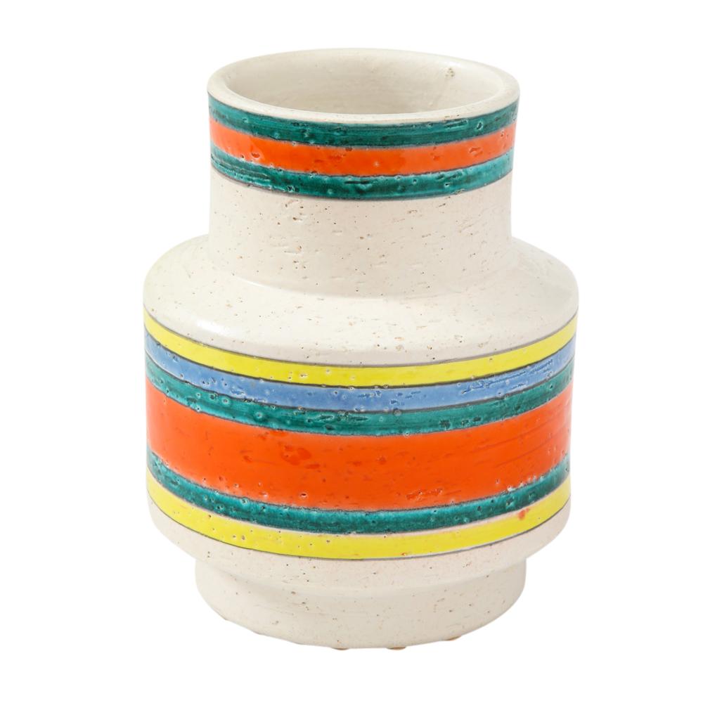 Italian ceramic vase, stripes, signed. Small scale chunky footed cylinder vase decorated with “fasce colorate” or colored bands of teal green, blue, orange, yellow, over an off-white glaze. Signed on the underside: 