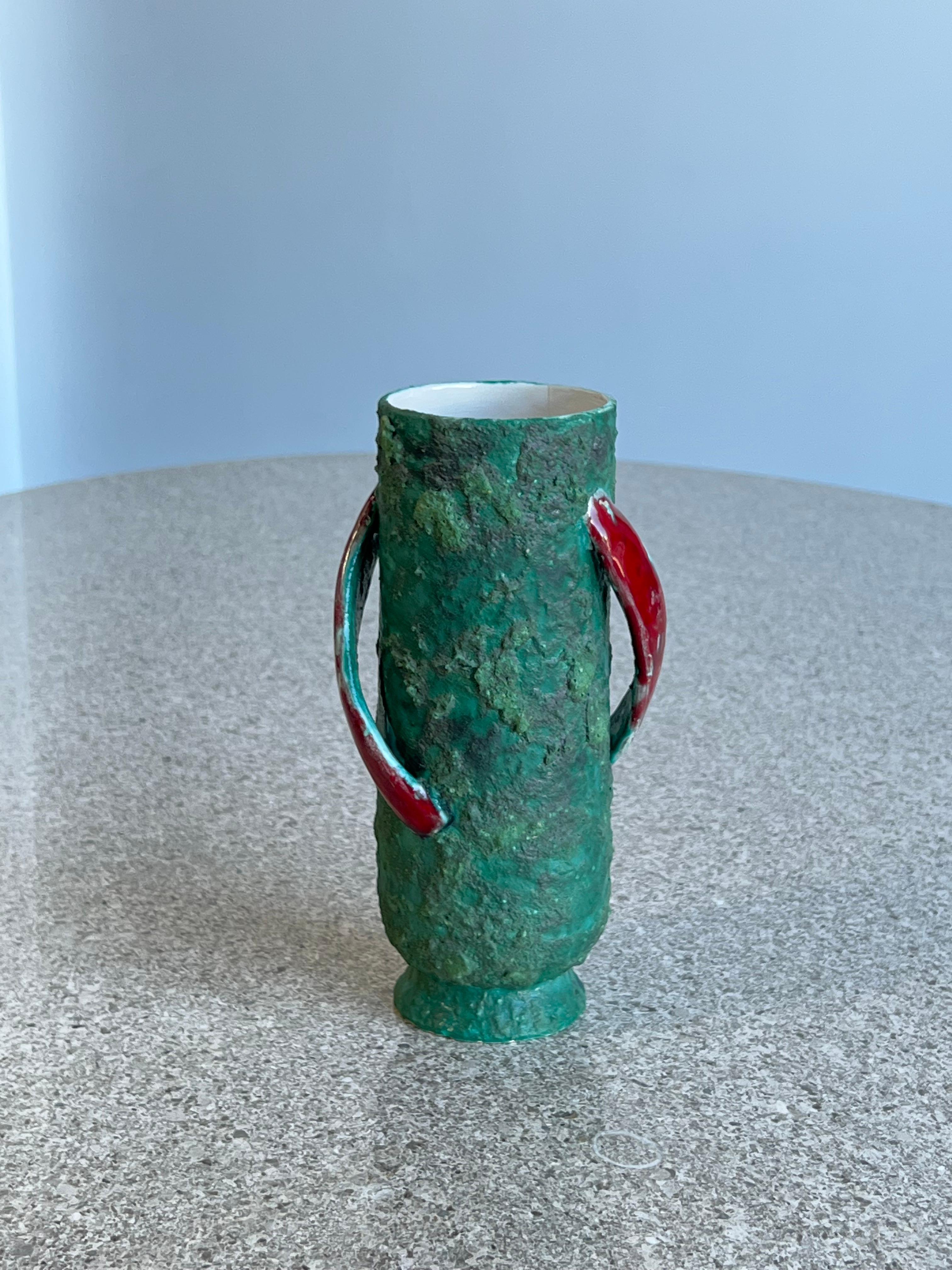 Art lava stunning vase 1960 Italy.
Beautiful aqua green colour and red glazed ceramic handles. 
Perfect centrepiece for a dinning table or credenza.
