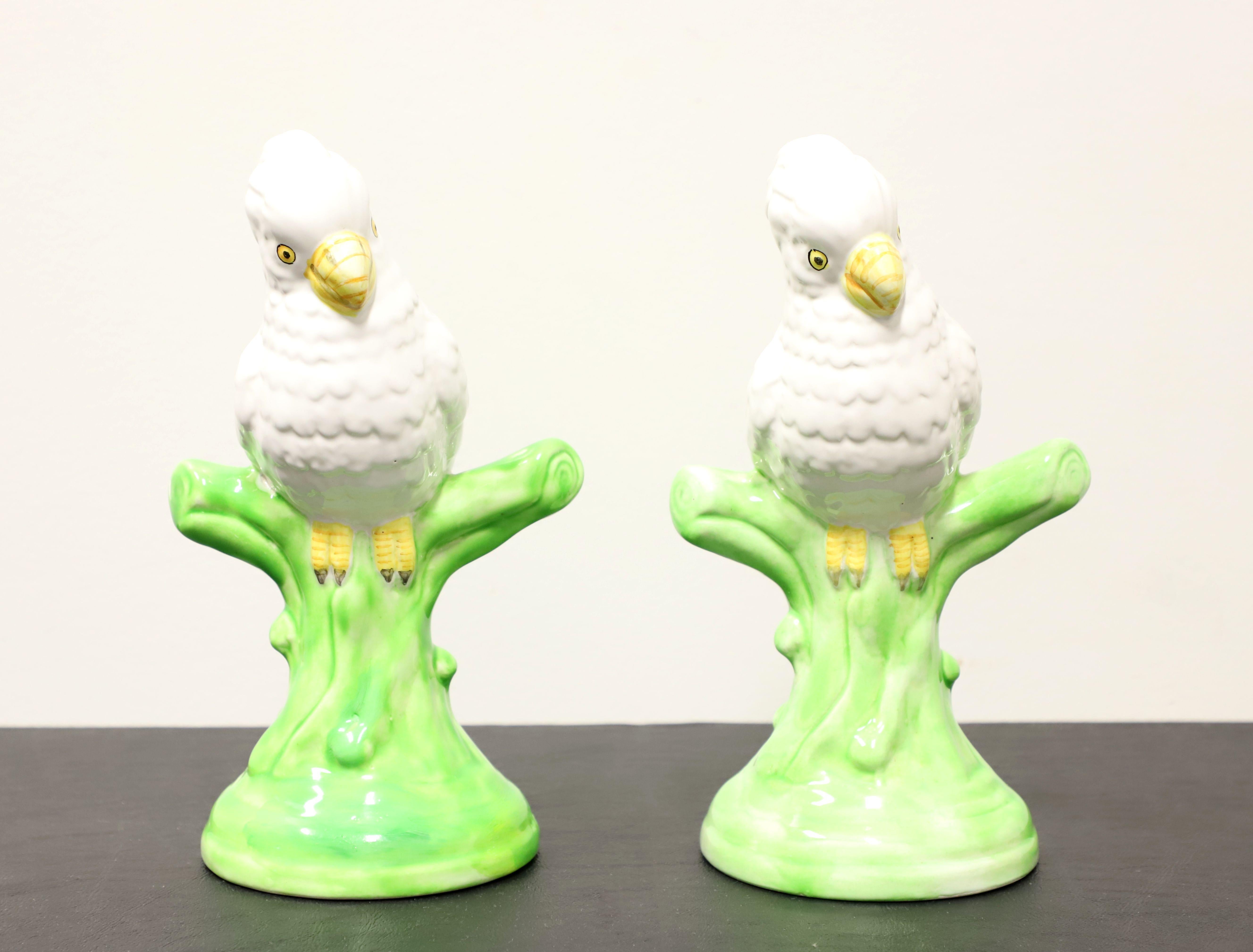 A pair of porcelain figurines depicting white parrots on tree branches. Multi-colored porcelain of primarily white, green, yellow & black, and glazed. Unsigned, artist unknown. Made in Italy, likely in the mid 20th Century.

Measures:  5.5w 4.5d