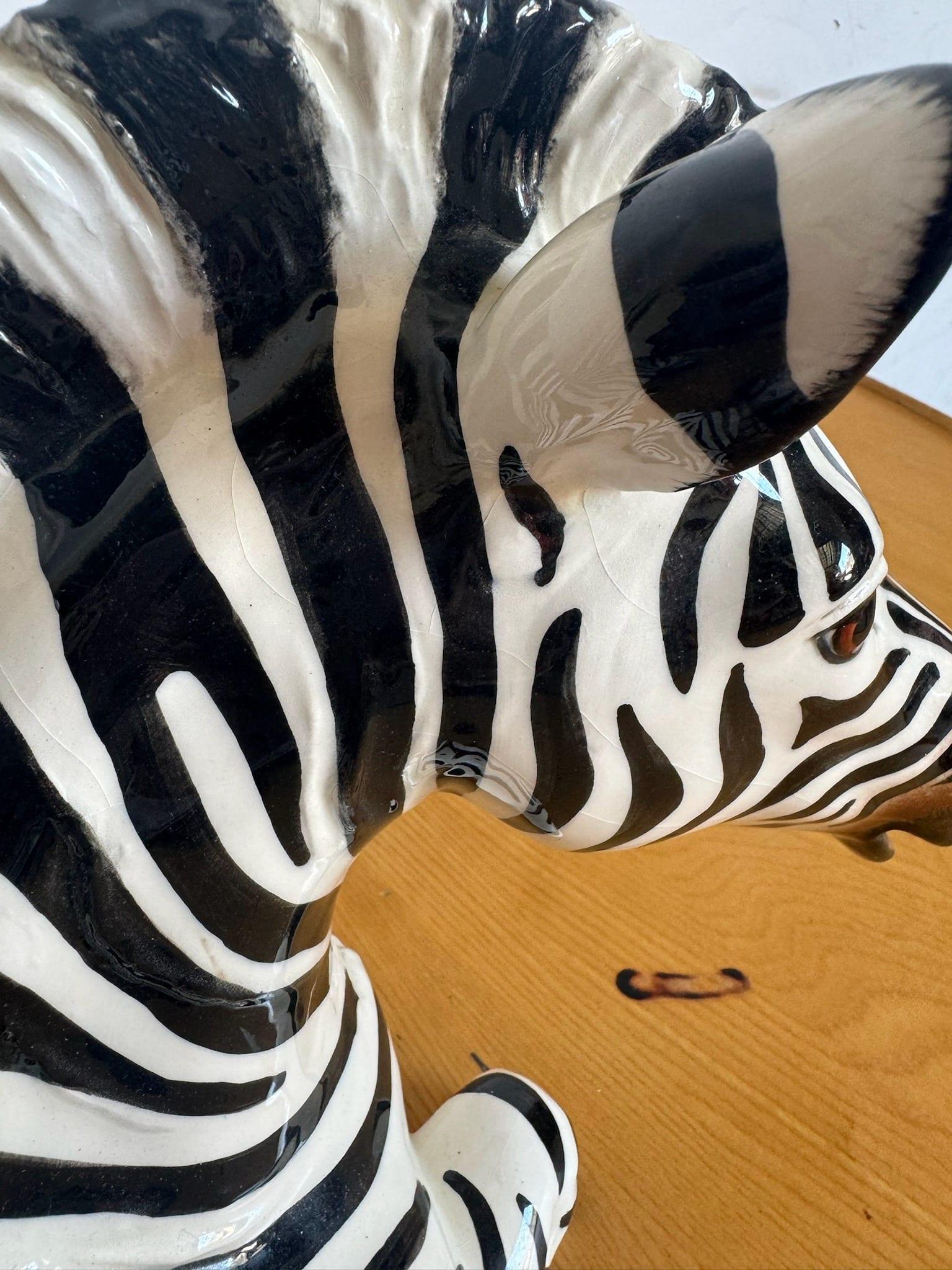 Add a touch of natural elegance to your home decor with this exquisite Italian Ceramic Zebra Sculpture by the Townsends, crafted in 1981. This stunning piece captures the beauty and grace of the zebra with intricate detailing and lifelike features.