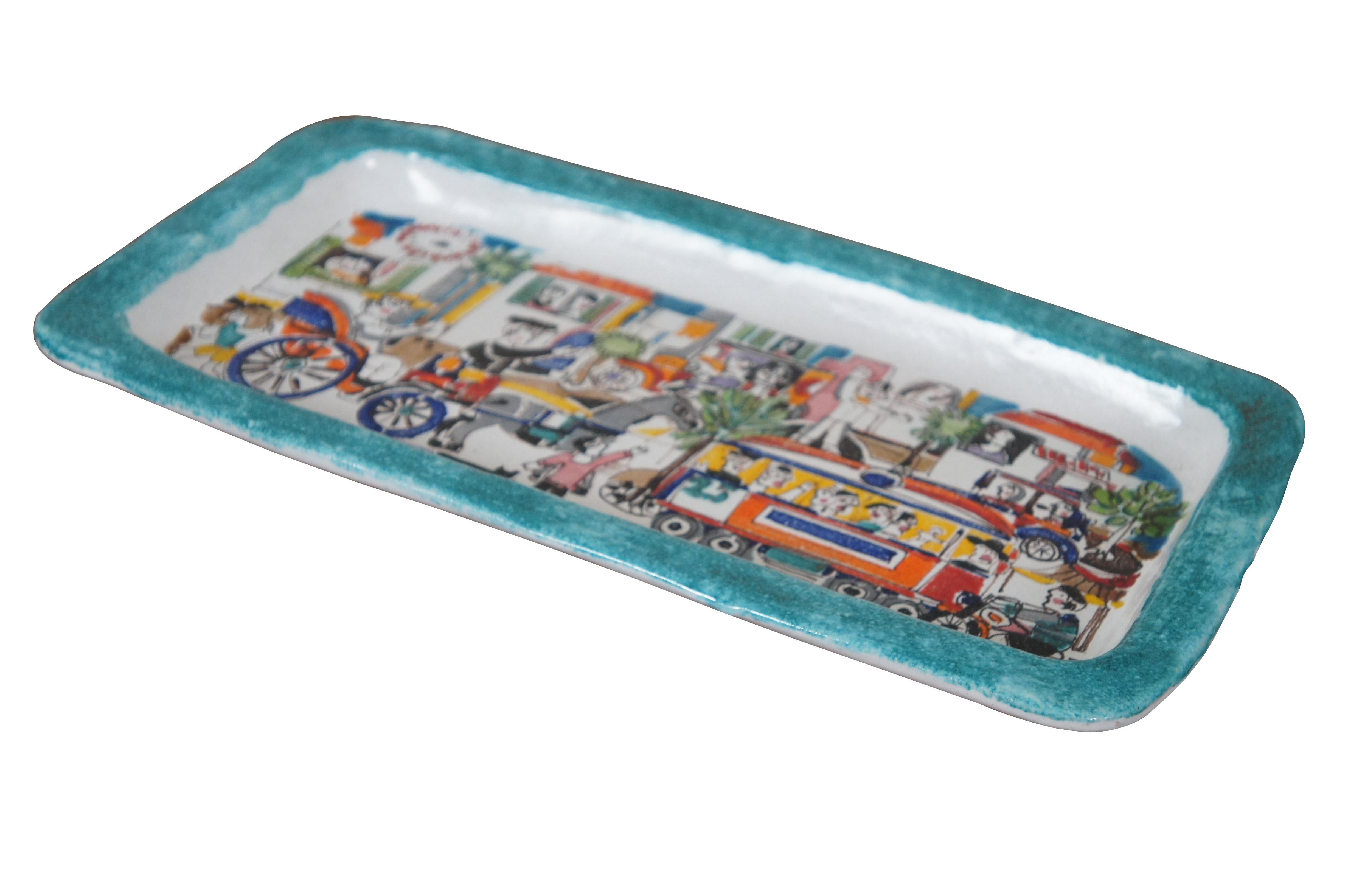 Vintage Italian ceramic pottery decorative serving tray by Ceramiche De Simone in their Folk line. Rectangular form with a teal blue border surround a bustling cityscape scene filled with a variety of figures and vehicles including cars, a trolley,