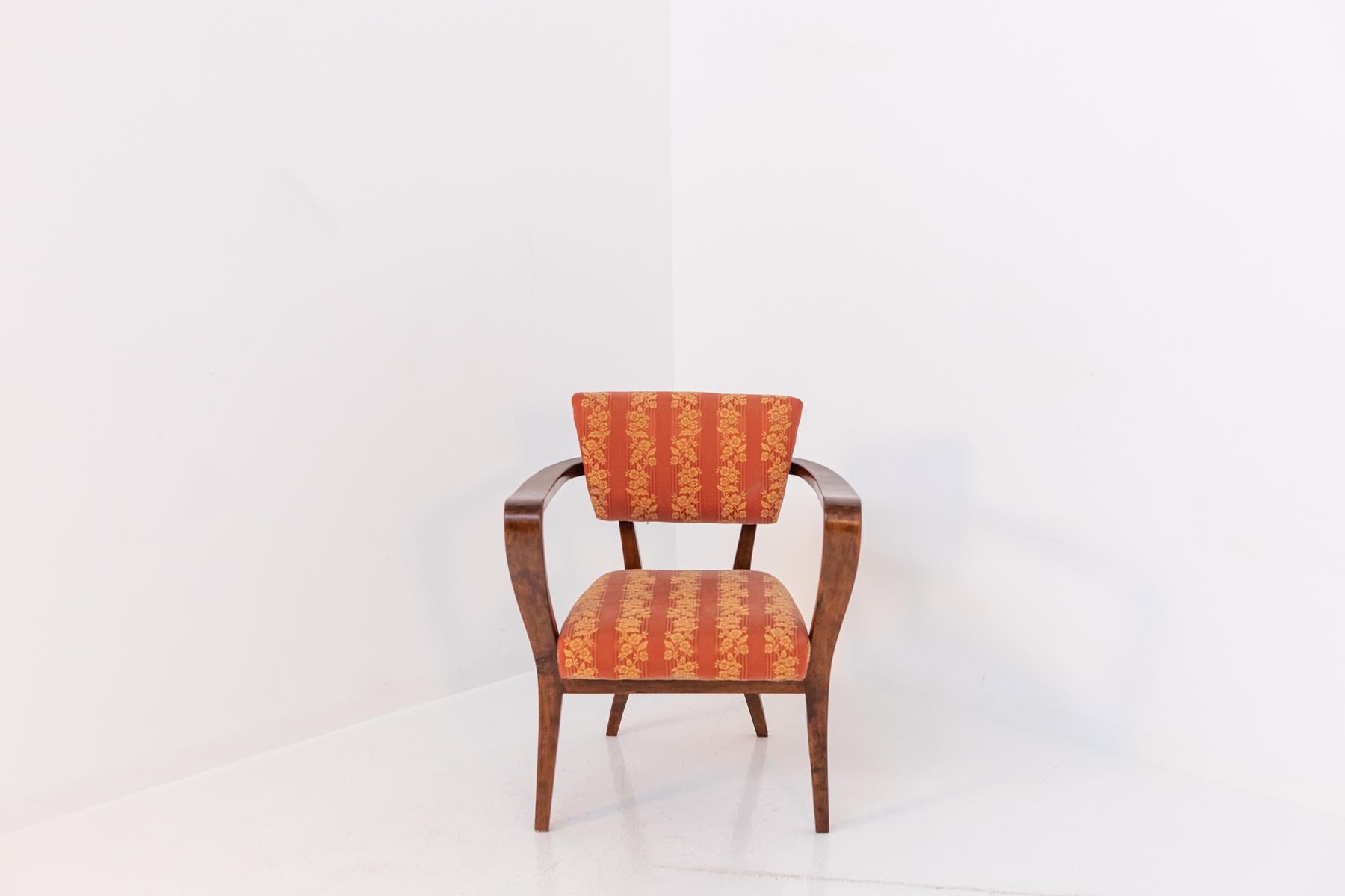 Elegant and harmonious Italian chair designed by Gio Ponti and published in the Rima catalog of the Gastone Rinaldi's study 1950s. The chair frame is made of fine wood, while the seat and back are upholstered and covered in a beautiful orange damask