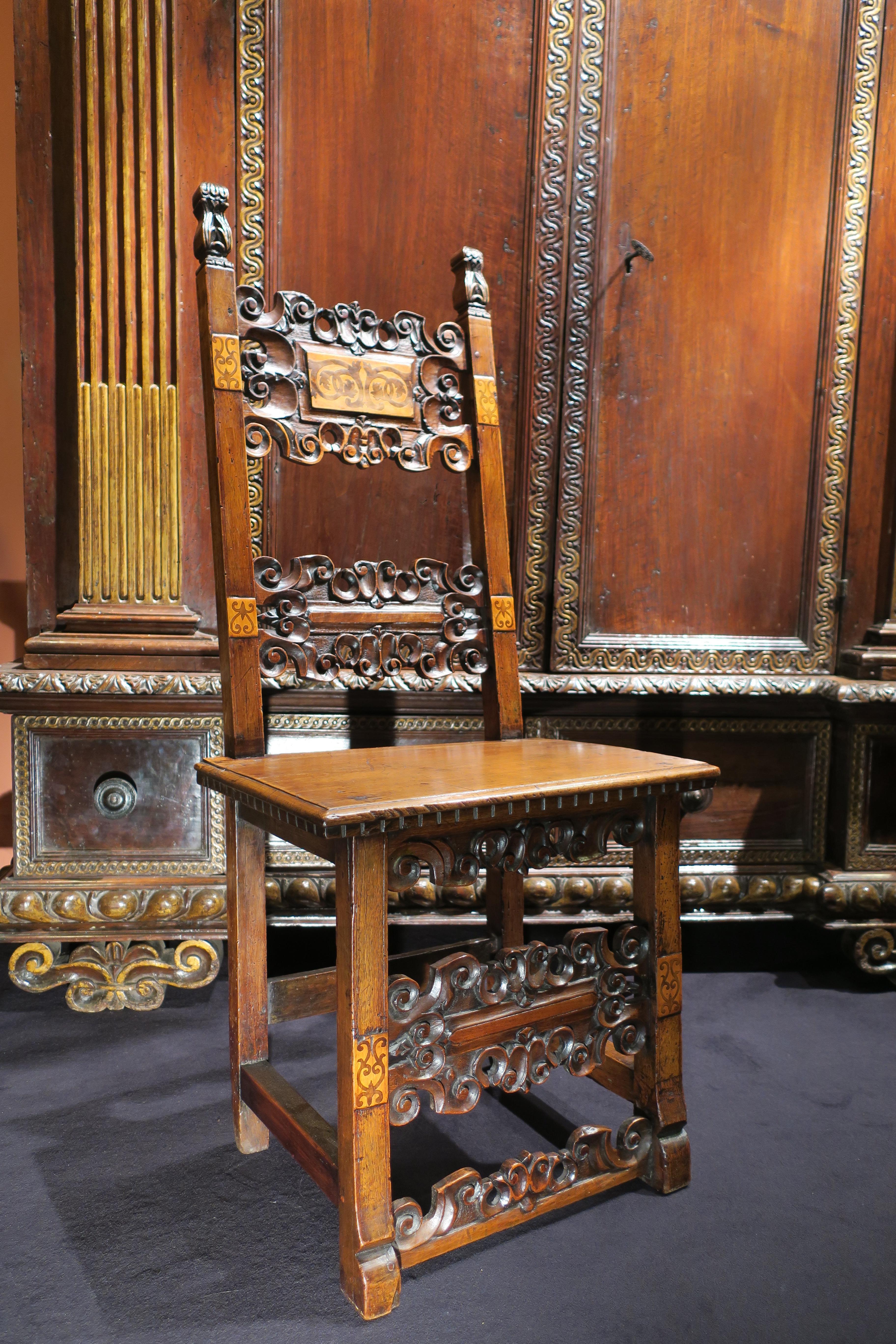 Origin: Italy, Tuscany
Period: End of 16th century

Measures: Height 117 cm
Seat: 51 x 37 cm

Light walnut wood
Very good condition

High-backed Italian chair with light wood marquetry, decorated with scrolls.
 