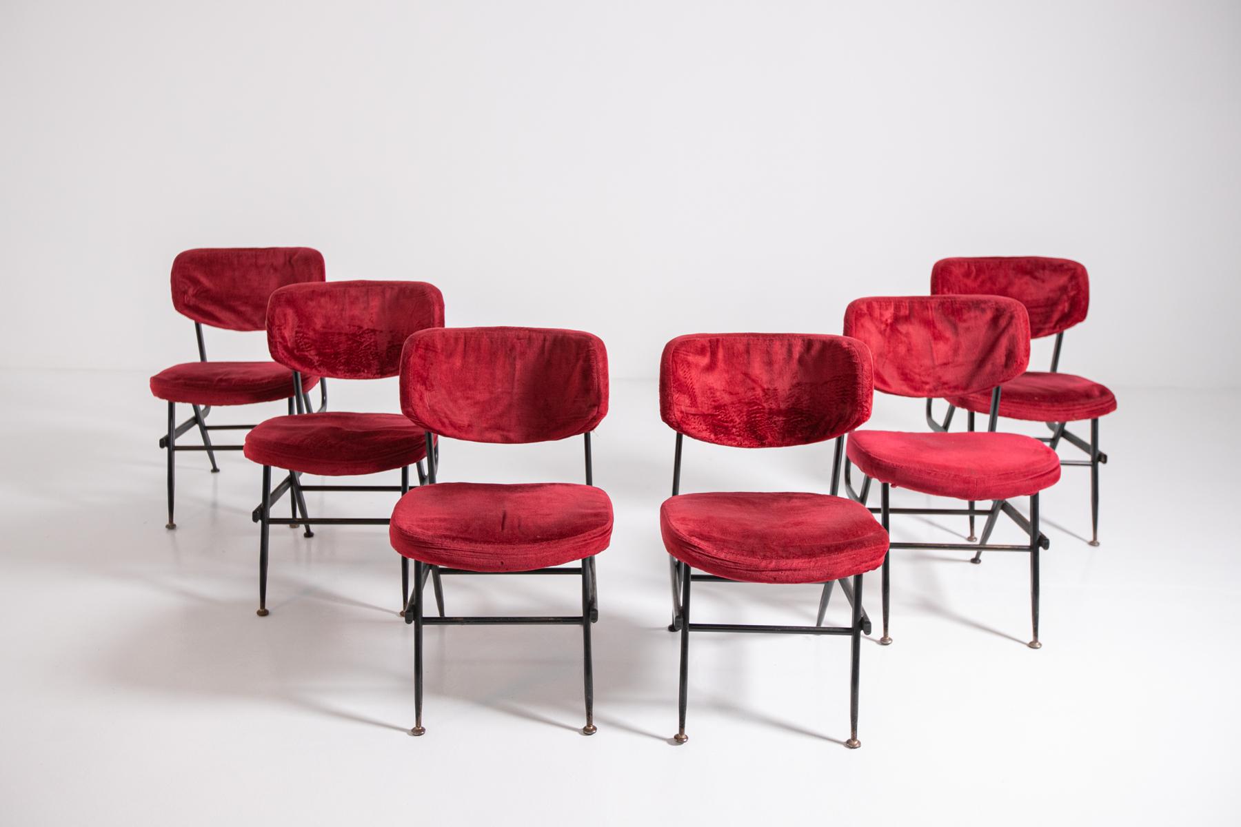 Beautiful set of six Italian chairs from the 1950s. The set has a black painted iron frame, forming geometric lines and a pleasing style. The feet have round brass ferrules, while the seat and backrest upholstery is in dark red velvet original to