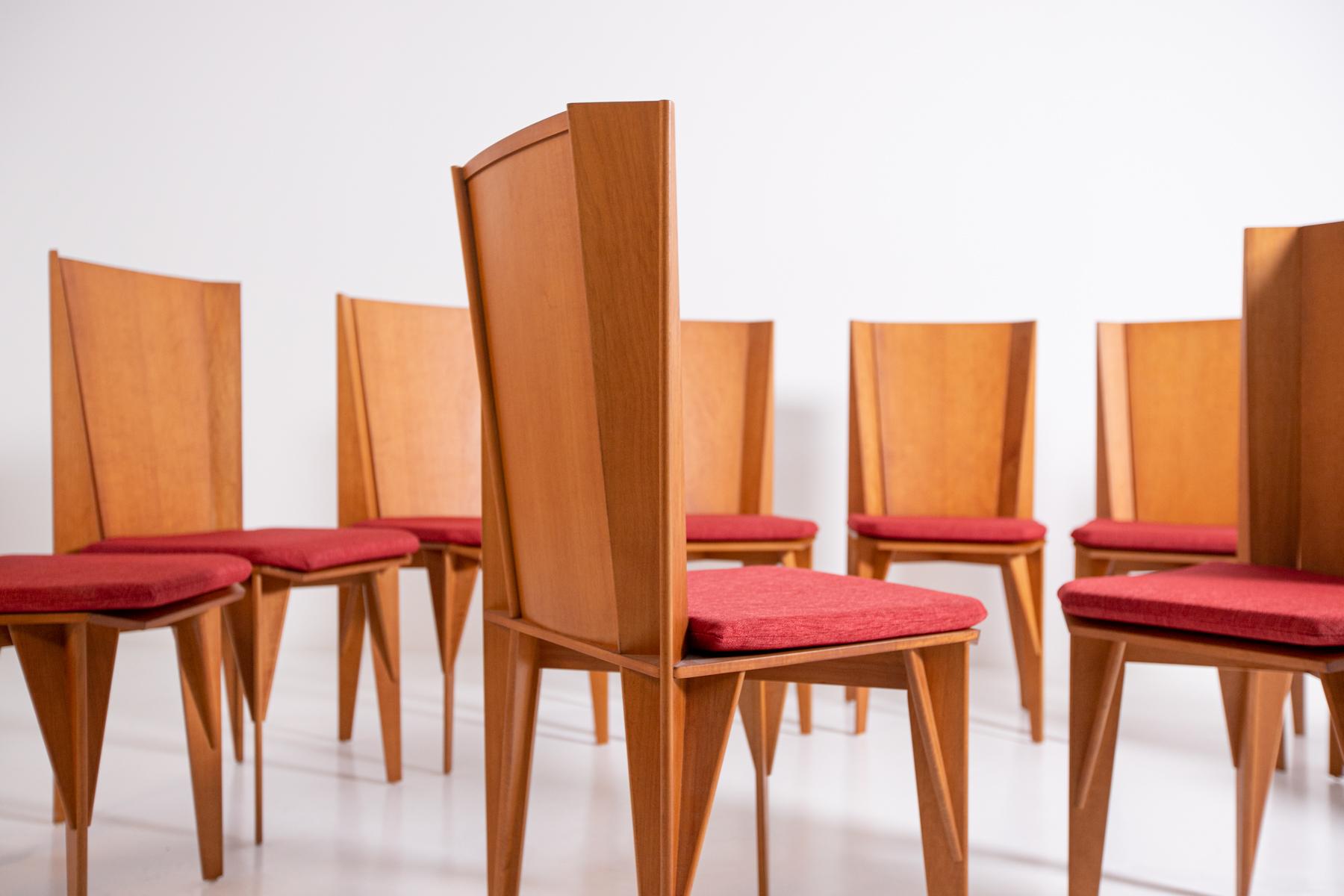 Set of 10 Giorgetti Matrix model chairs in wood with original seat of the time in red fabric in excellent condition. Architectural chair by Adriano and Paolo Suman for Giorgetti, Italy, circa 1984. This chair is from the Matrix series. It is