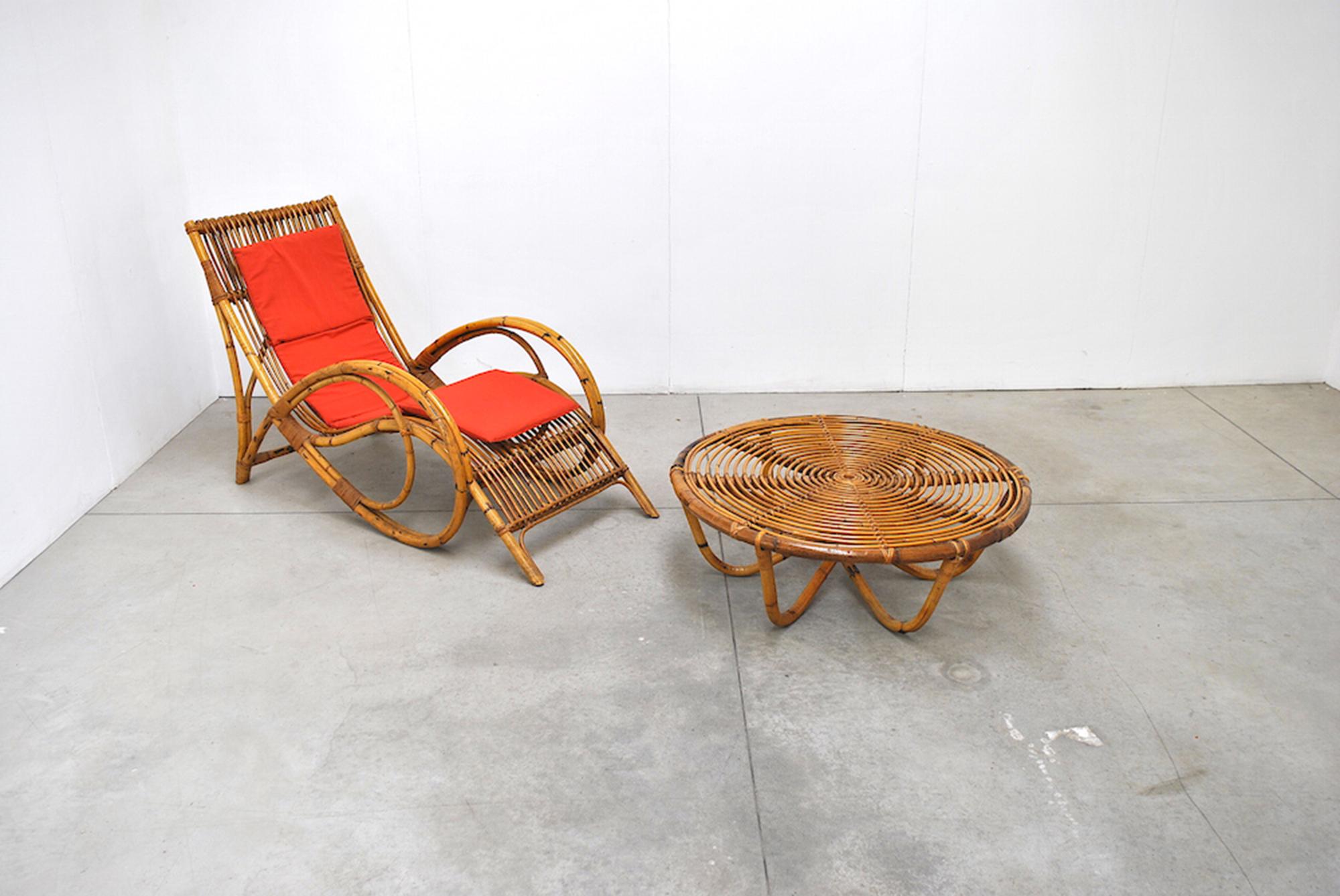 Tito Agnoli chaise lounge in wicker and bamboo, 1960s.

This fabric on this chair is customized. We have our own in-house upholstery studio that can expertly reupholster this piece. If you wish to pick another fabric please do not hesitate to do so.