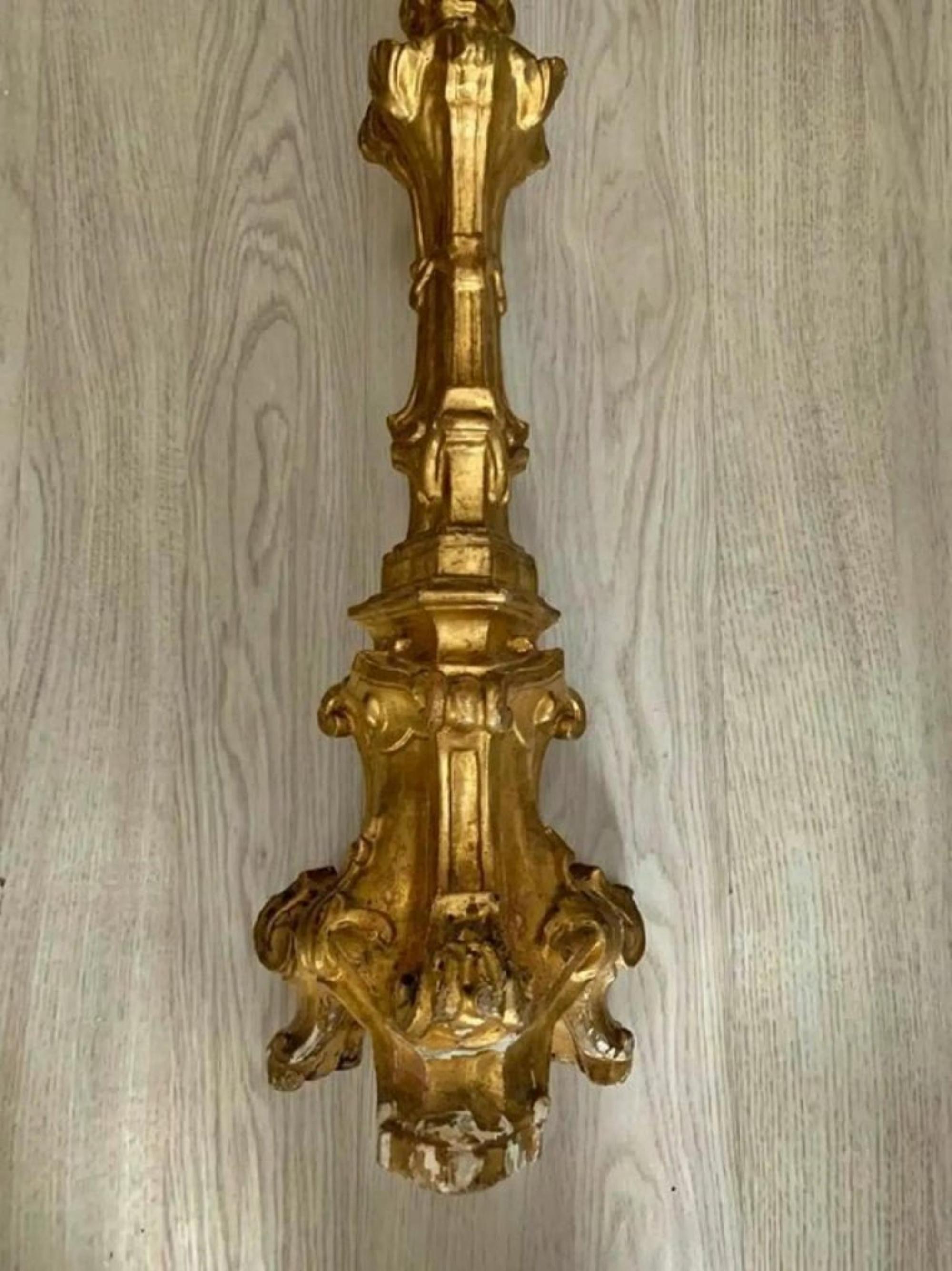 Title: Chandelier
Date/Period: 18th century
Dimension: 84cm
Materials: golden painted wood
Additional Information: Italian candle holder from the 18th century.

 